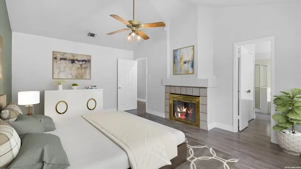 a bedroom with a bed and a fireplace