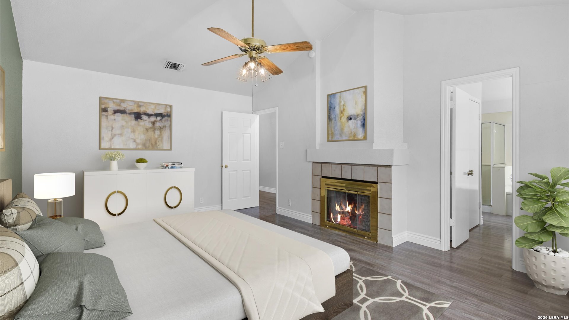 9847 Spring Harvest San Antonio, TX 78254 - Photo 14 of 27 a bedroom with a bed and a fireplace