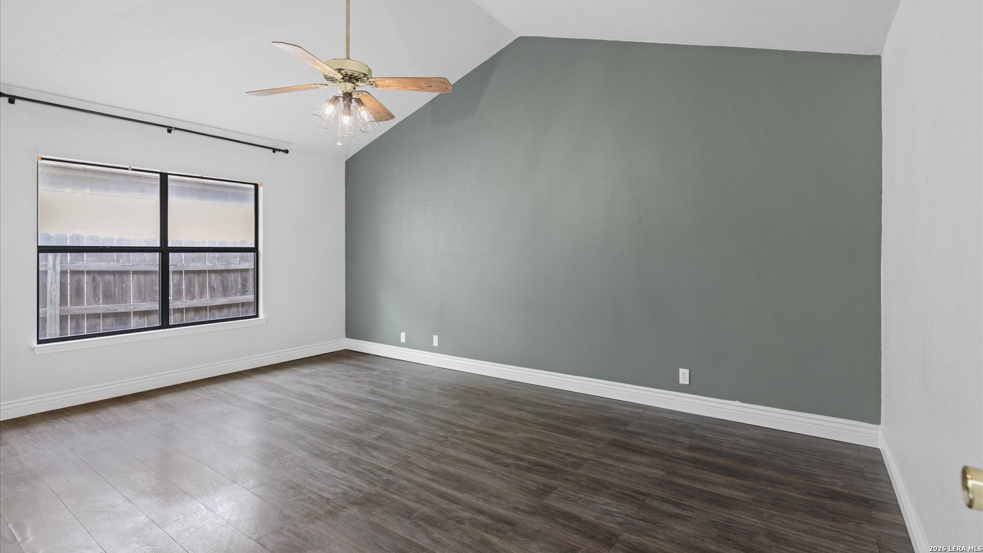 9847 Spring Harvest San Antonio, TX 78254 - Photo 15 of 27 an empty room with wooden floor chandelier and windows