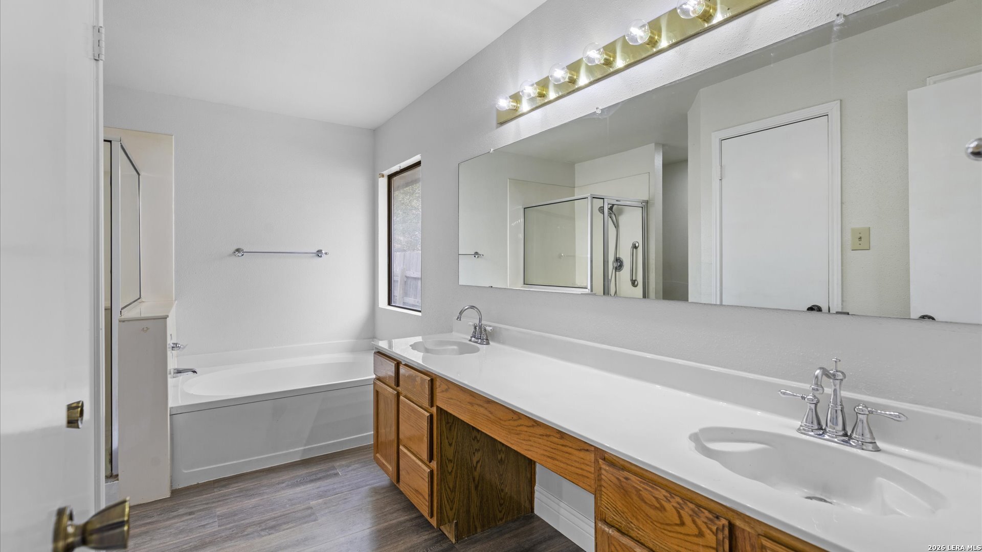9847 Spring Harvest San Antonio, TX 78254 - Photo 17 of 27 a bathroom with a sink double vanity granite tub and shower
