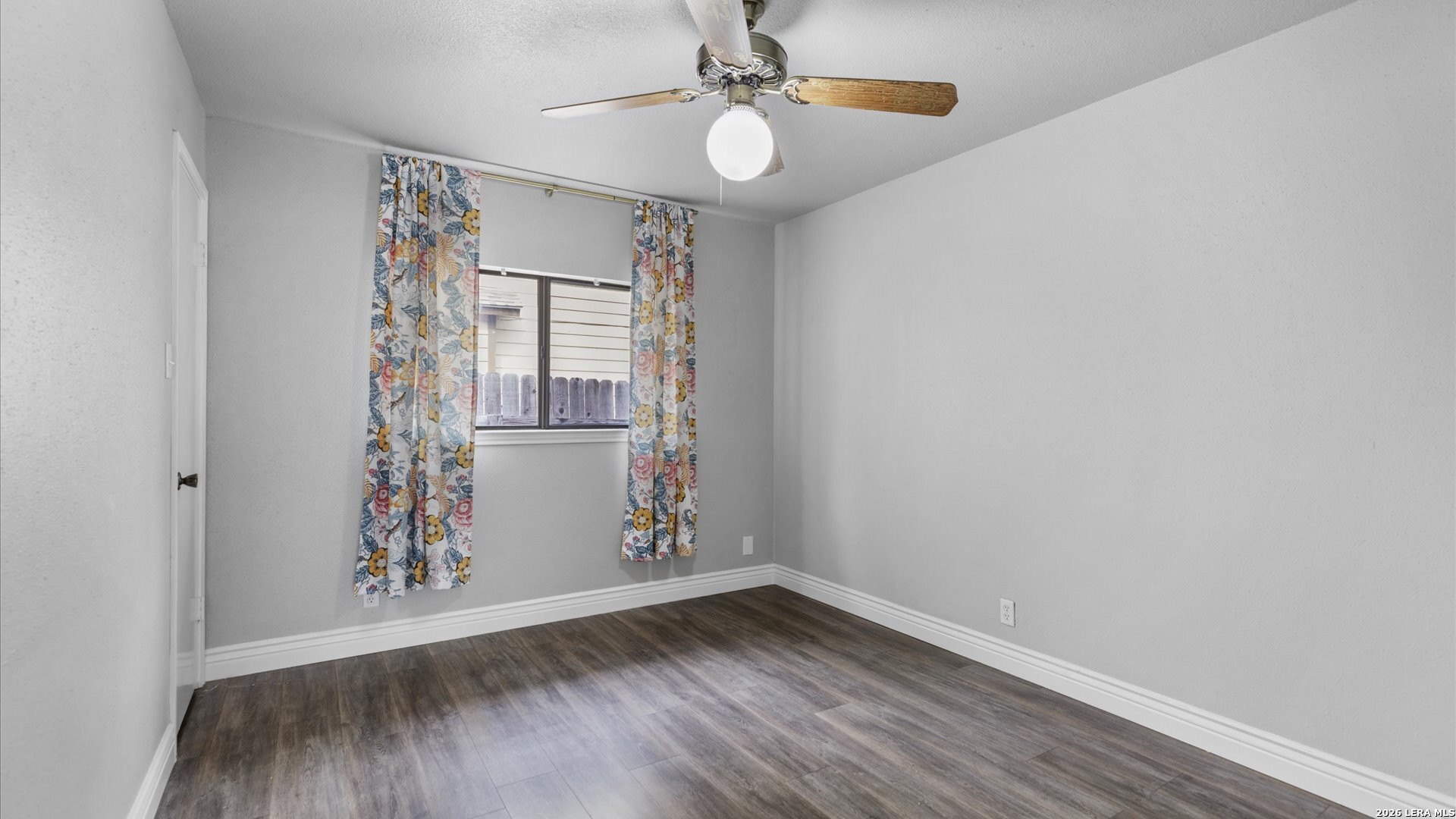 9847 Spring Harvest San Antonio, TX 78254 - Photo 19 of 27 an empty room with wooden floor and windows