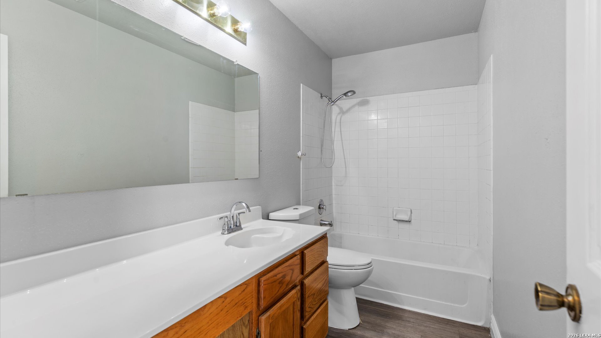 9847 Spring Harvest San Antonio, TX 78254 - Photo 20 of 27 a bathroom with a granite countertop sink toilet and shower