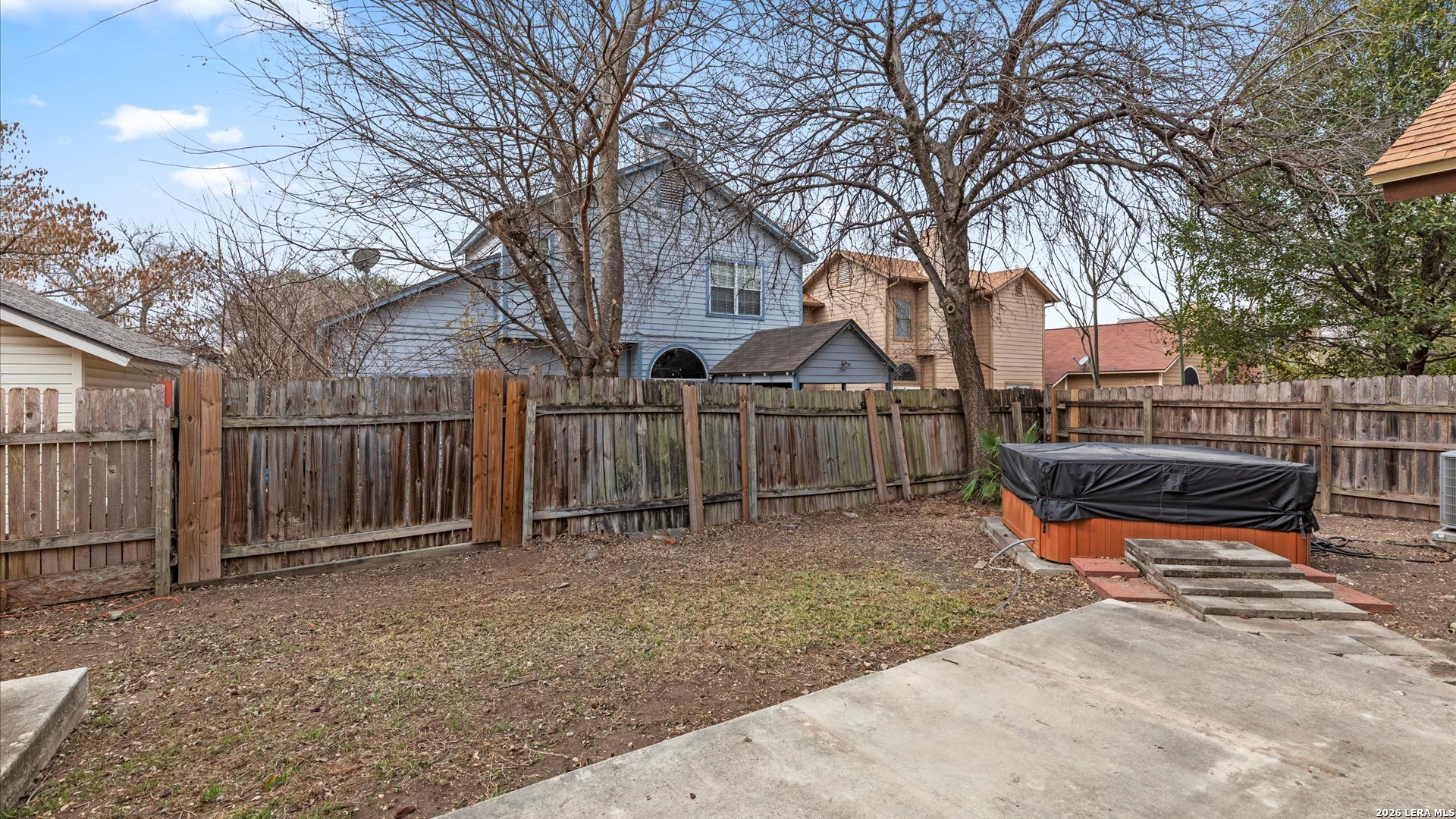 9847 Spring Harvest San Antonio, TX 78254 - Photo 25 of 27 a view of a house with backyard and trees