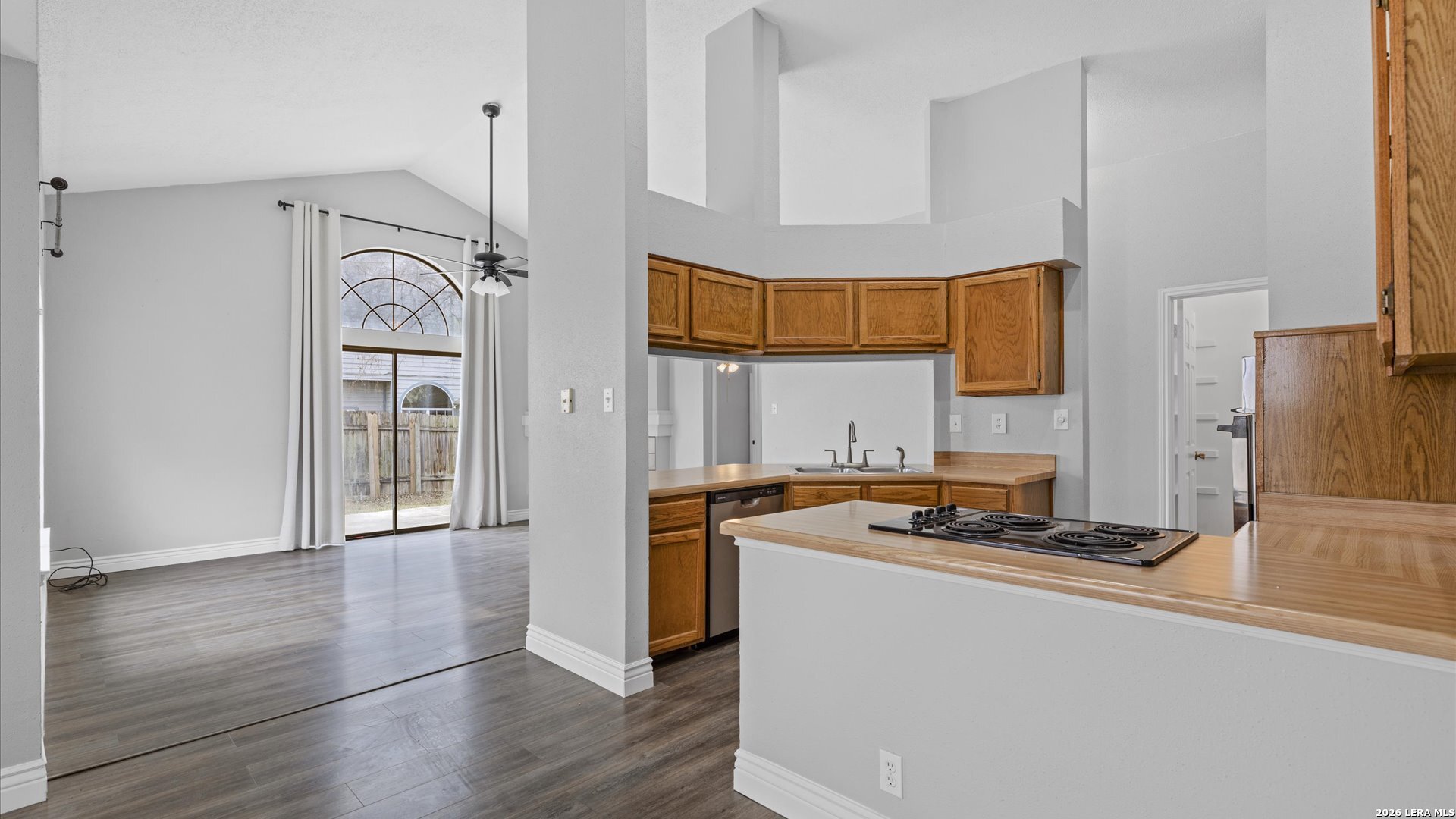 9847 Spring Harvest San Antonio, TX 78254 - Photo 6 of 27 a kitchen with stainless steel appliances granite countertop a sink stove and refrigerator