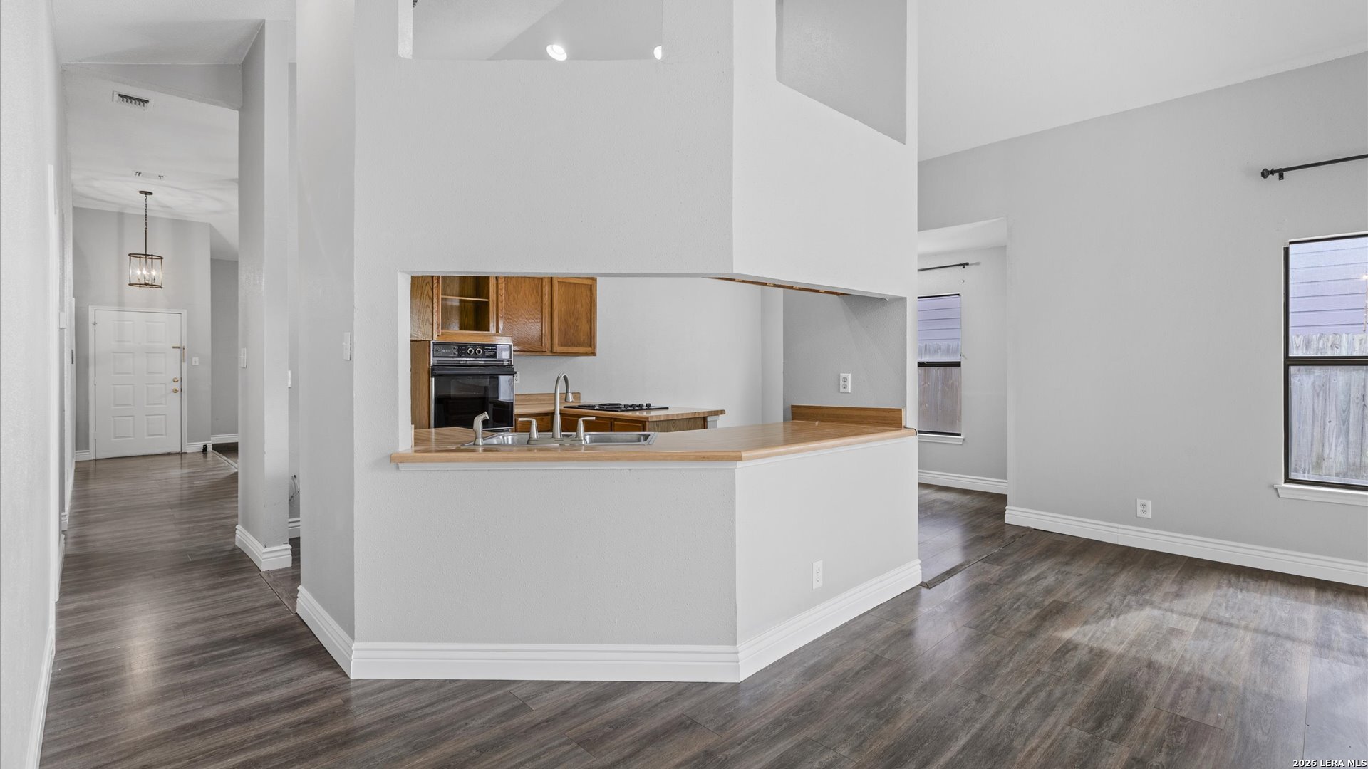 9847 Spring Harvest San Antonio, TX 78254 - Photo 7 of 27 a view of kitchen with refrigerator and window