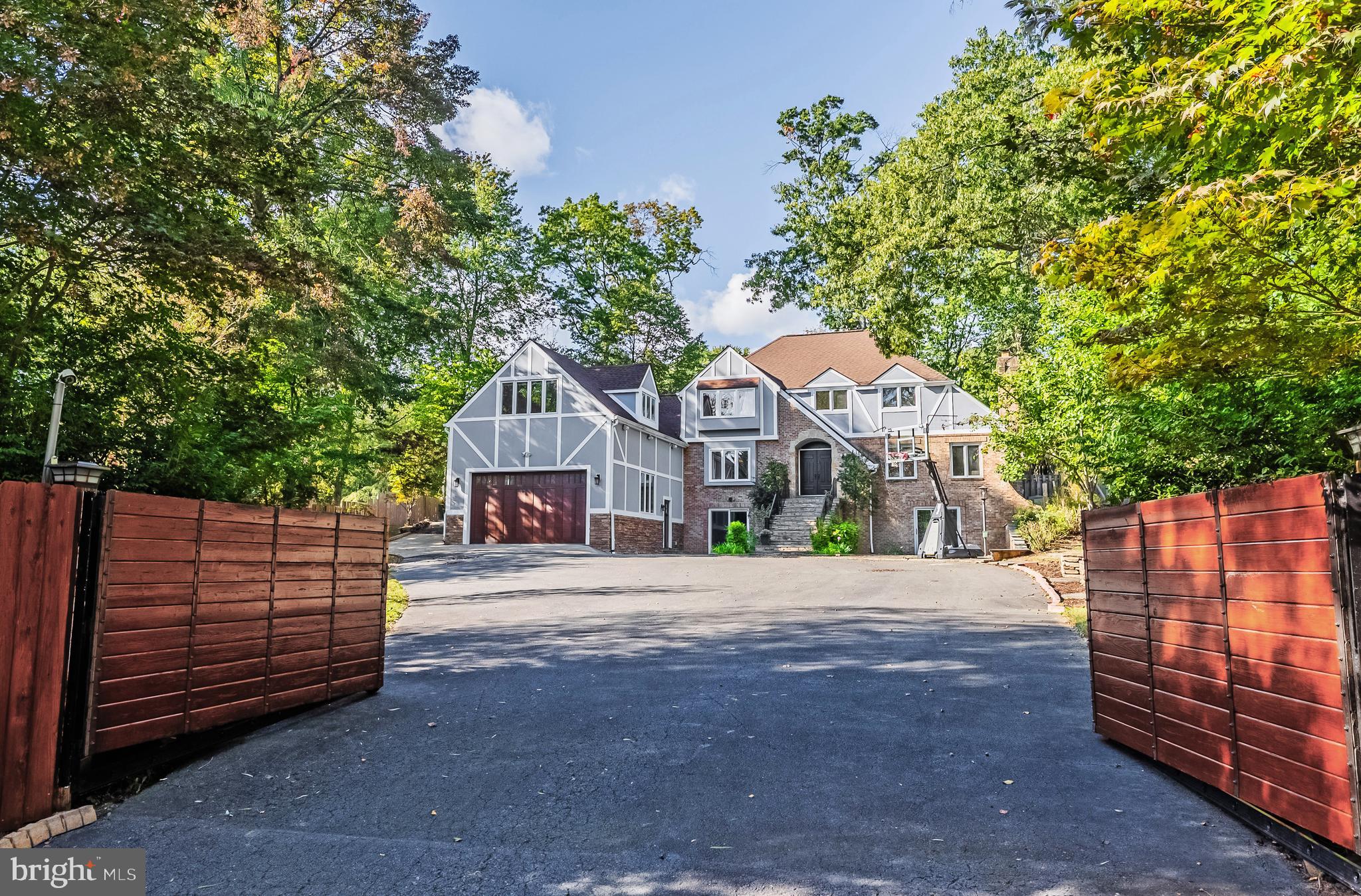 Front Gates Open to Impressive Tutor Colonial