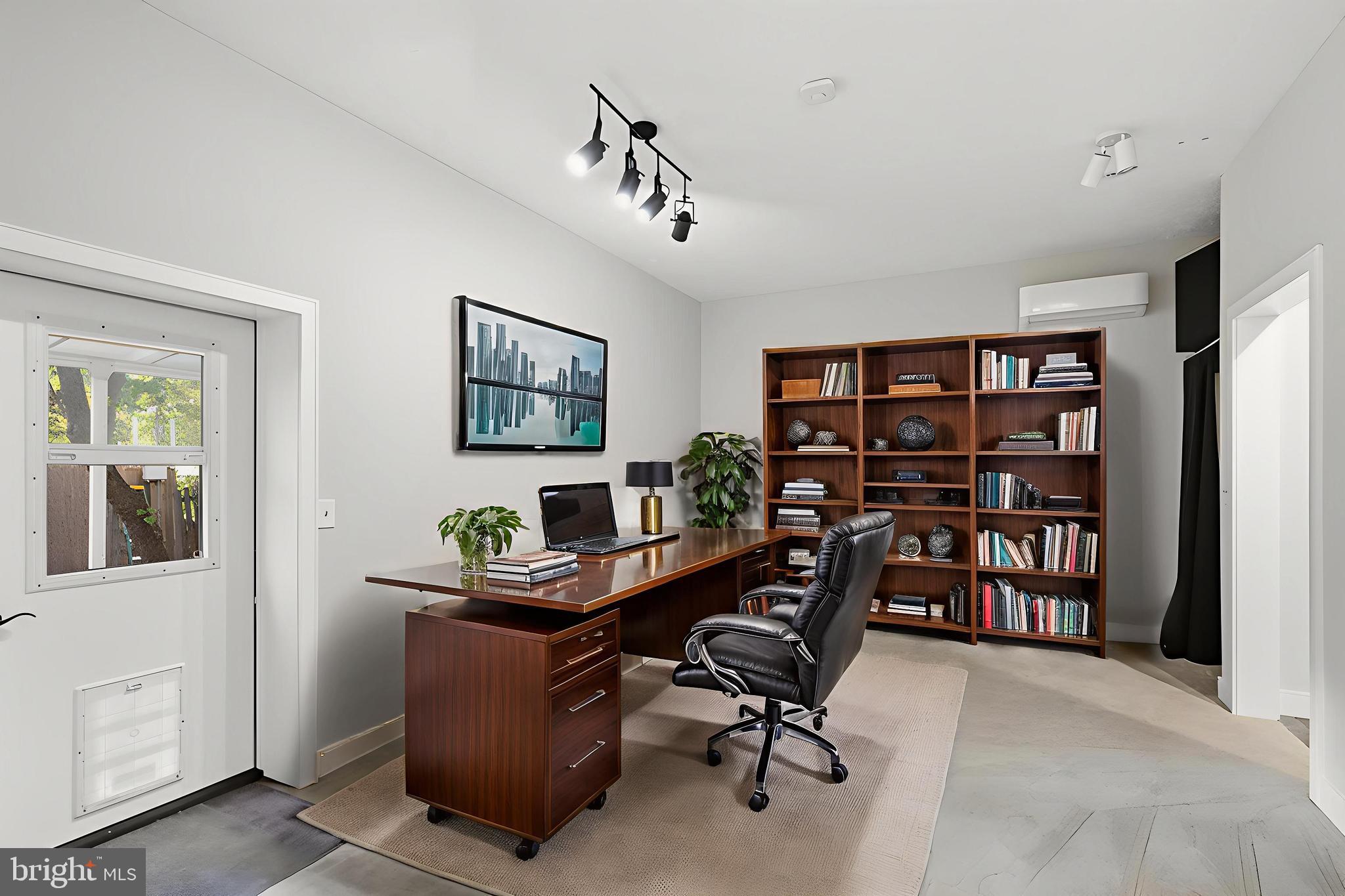 2352 Cedar Lane Vienna, VA 22182 - Photo 18 of 59 a view of a workspace with a bookshelf