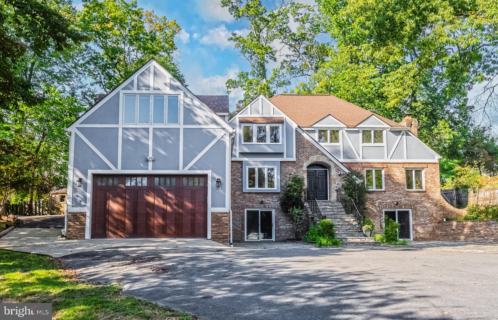 2352 Cedar Lane Vienna, VA 22182 - Photo 2 of 59 a front view of a house with a yard