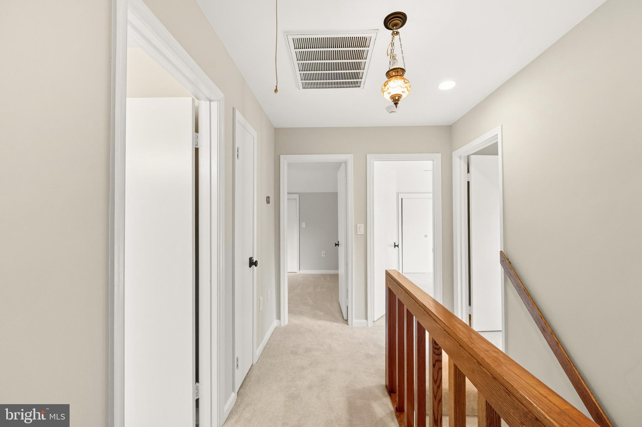 2352 Cedar Lane Vienna, VA 22182 - Photo 21 of 59 a view of a hallway with a chandelier