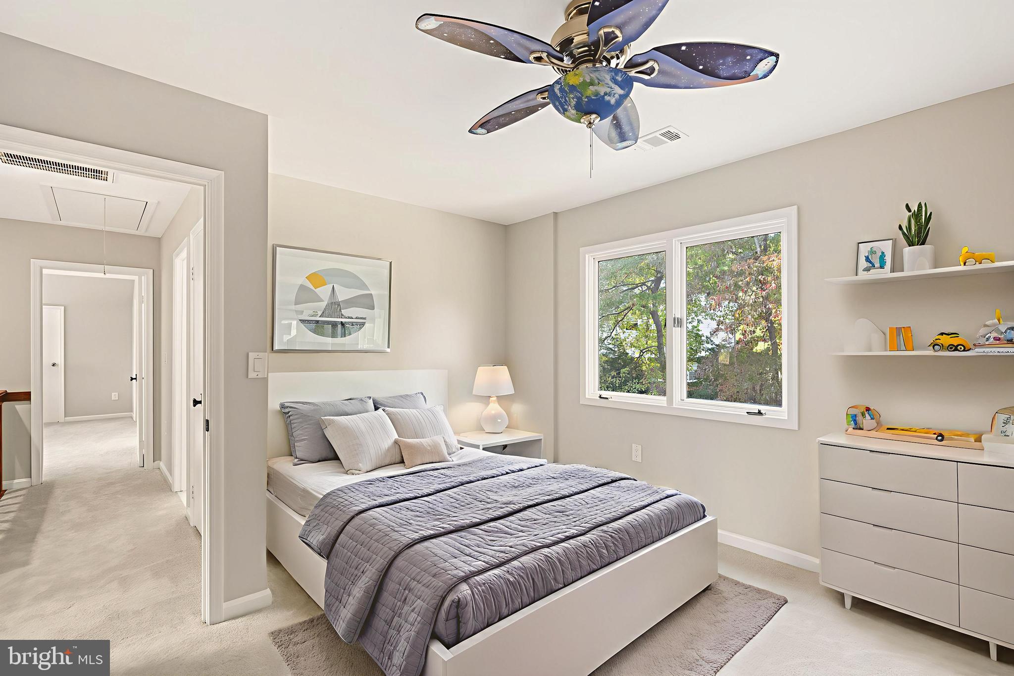 2352 Cedar Lane Vienna, VA 22182 - Photo 29 of 59 a bedroom with a bed and a chandelier