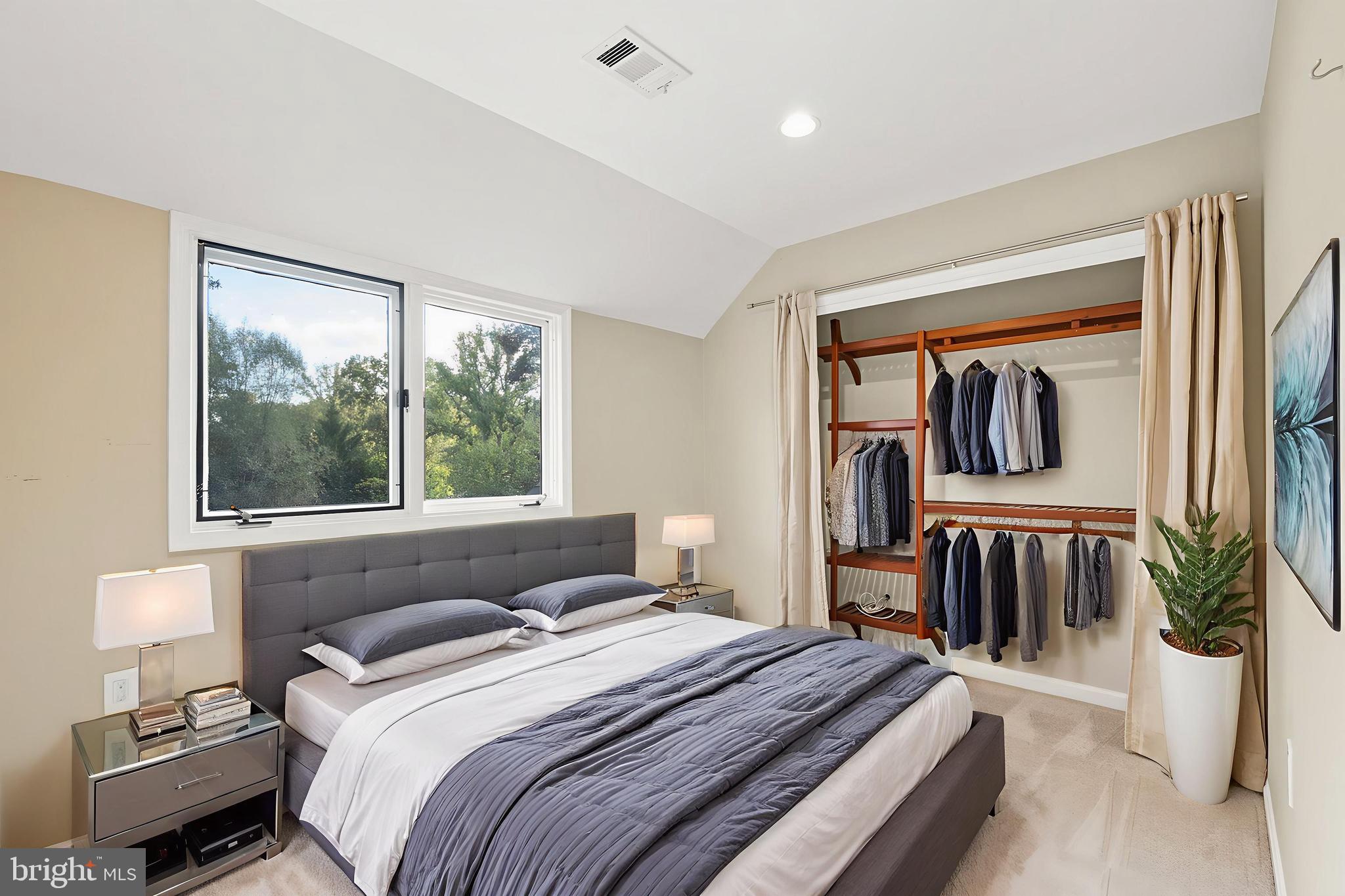 2352 Cedar Lane Vienna, VA 22182 - Photo 34 of 59 a bedroom with a bed and large window