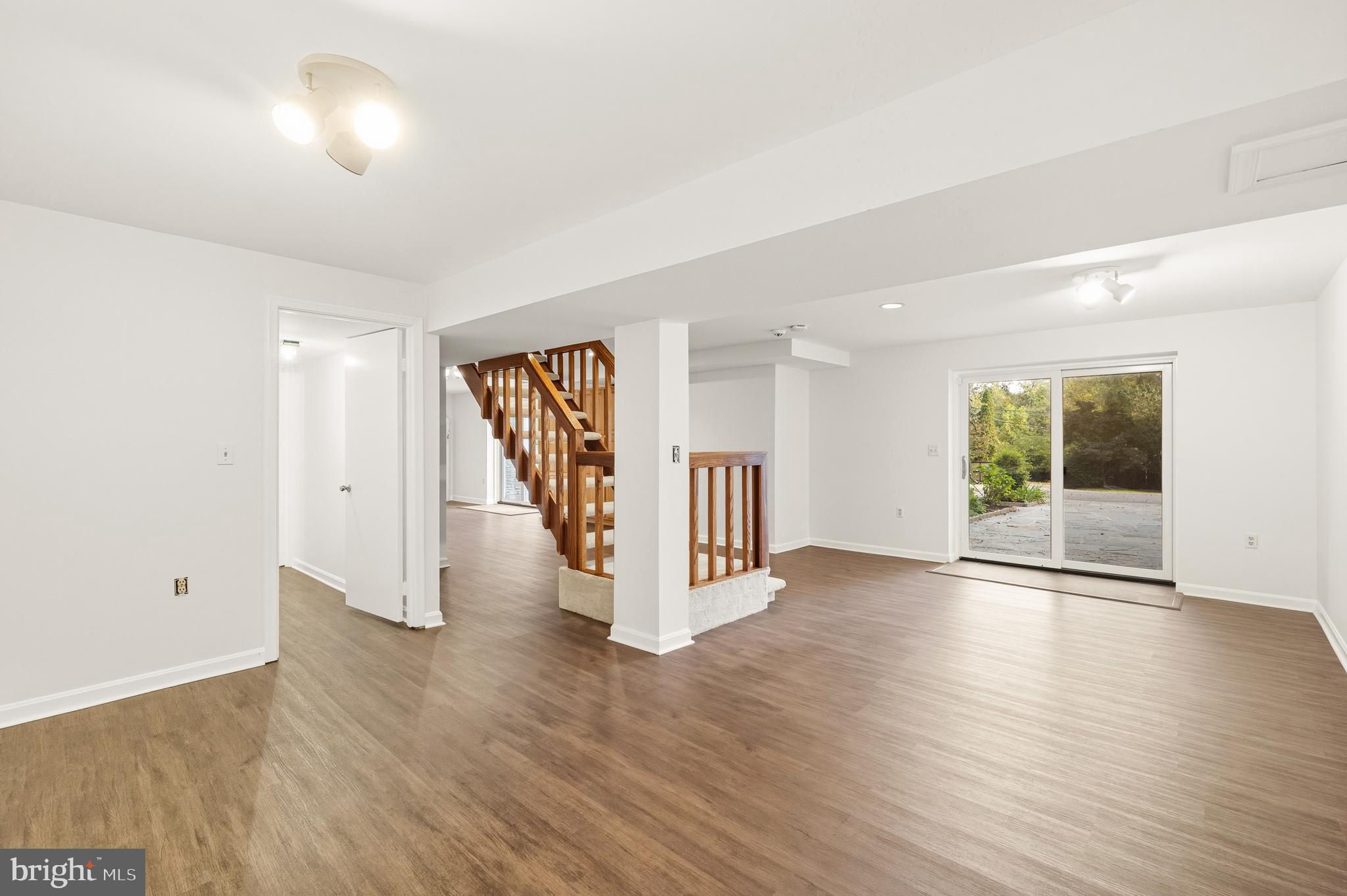 2352 Cedar Lane Vienna, VA 22182 - Photo 39 of 59 a view of an empty room with wooden floor and a window
