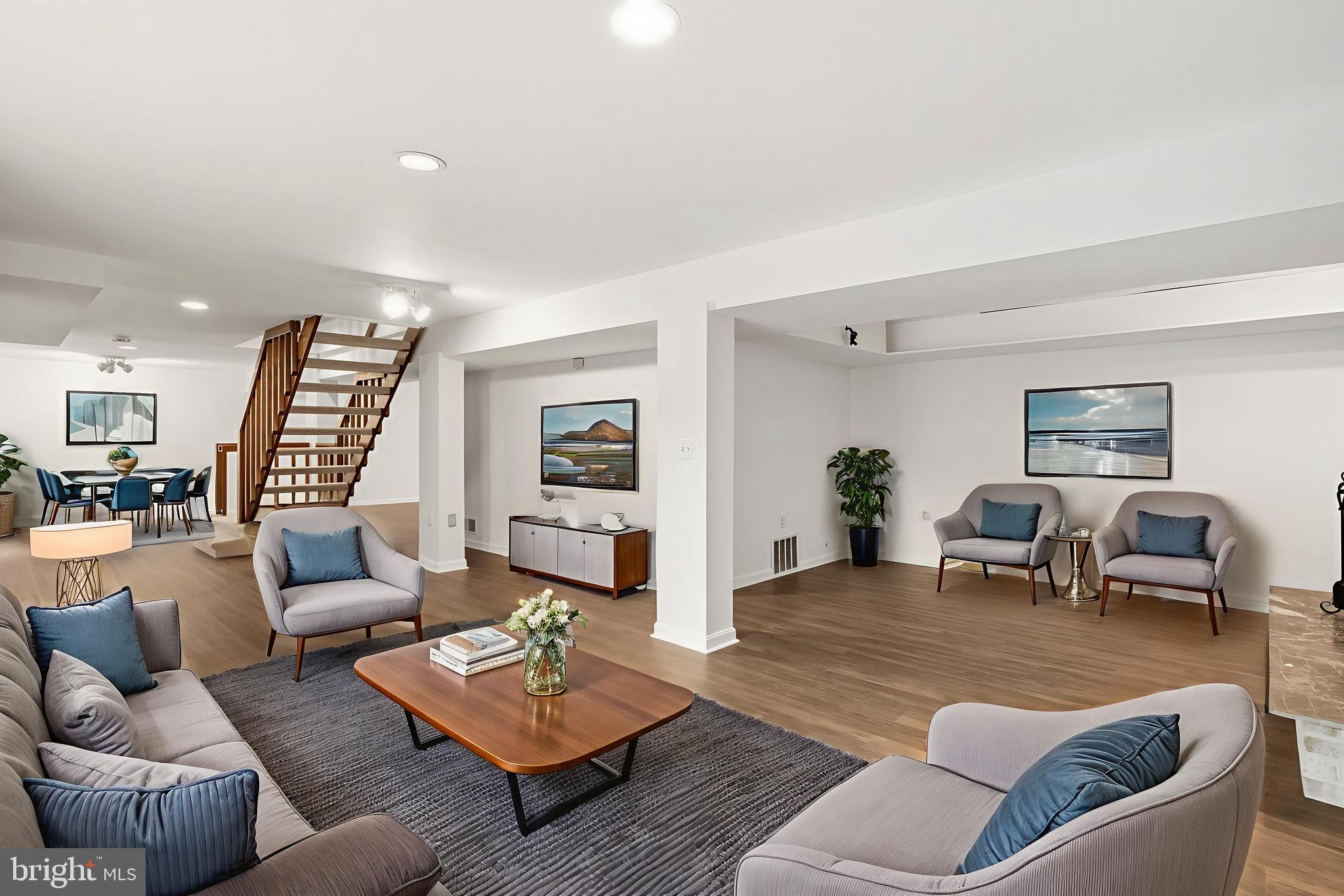 2352 Cedar Lane Vienna, VA 22182 - Photo 40 of 59 a living room with furniture and wooden floor