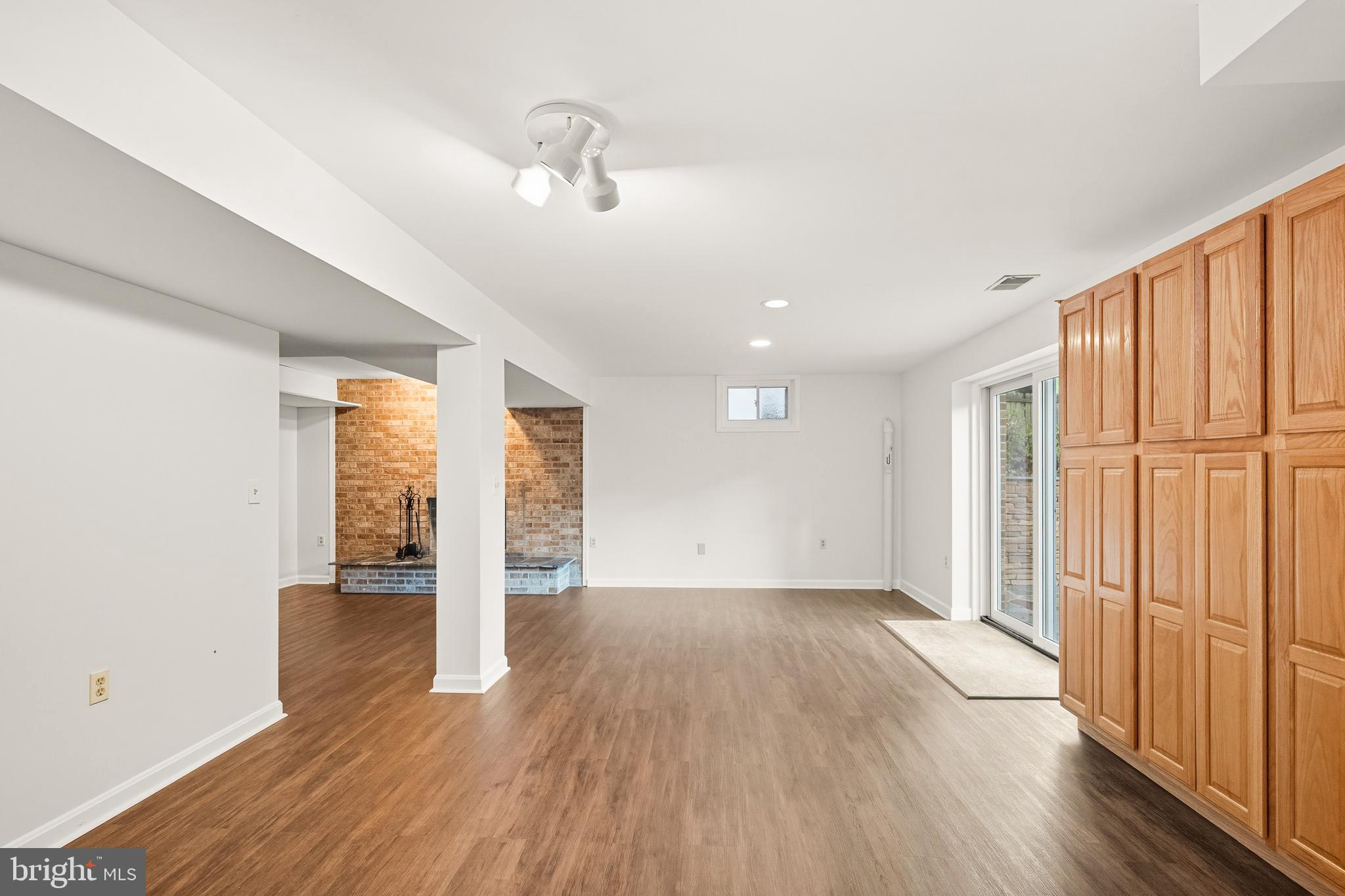 2352 Cedar Lane Vienna, VA 22182 - Photo 41 of 59 an empty room with wooden floor and windows