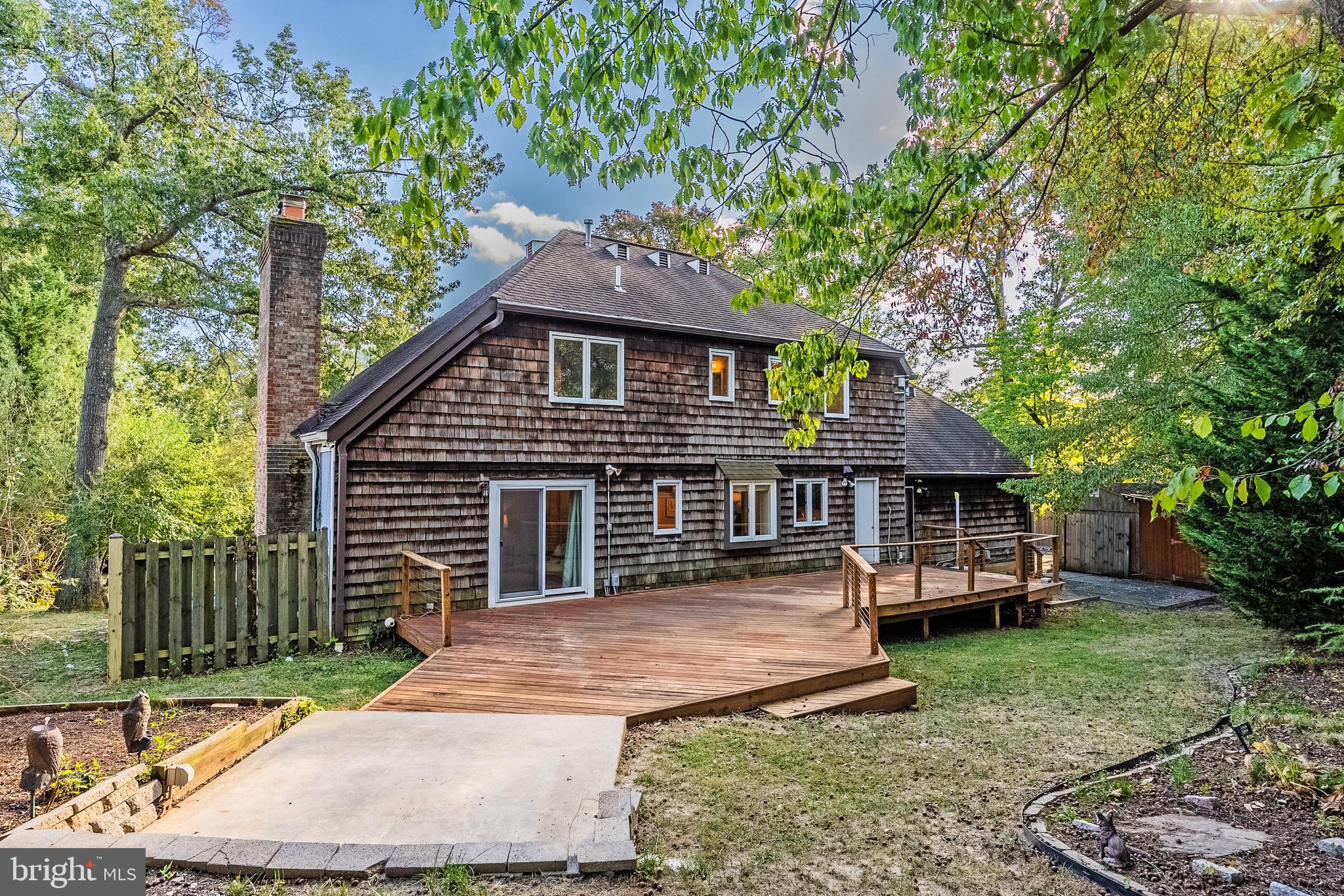 2352 Cedar Lane Vienna, VA 22182 - Photo 45 of 59 a front view of a house with a yard table and chairs