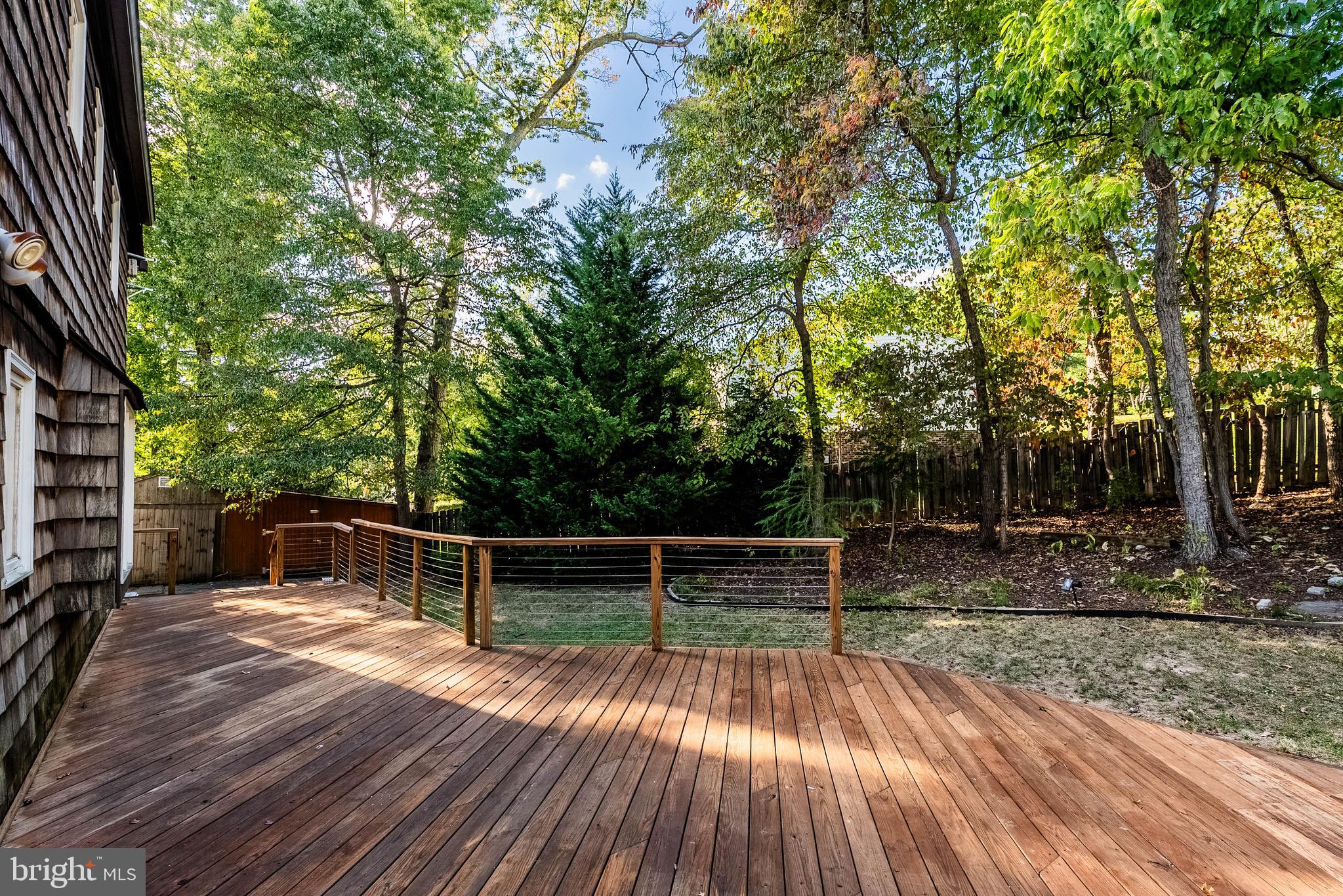 2352 Cedar Lane Vienna, VA 22182 - Photo 46 of 59 a view of backyard with wooden floor and large trees