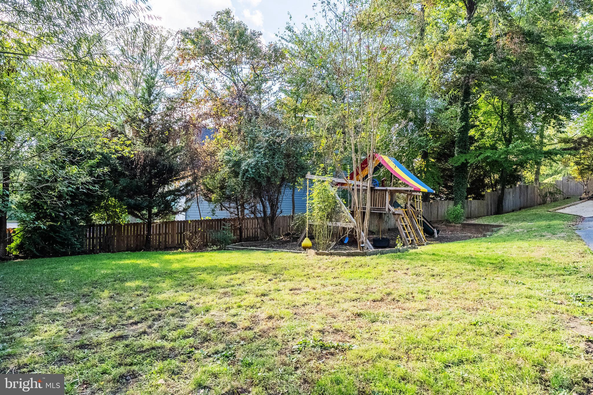 2352 Cedar Lane Vienna, VA 22182 - Photo 52 of 59 a view of a house with a yard and sitting area