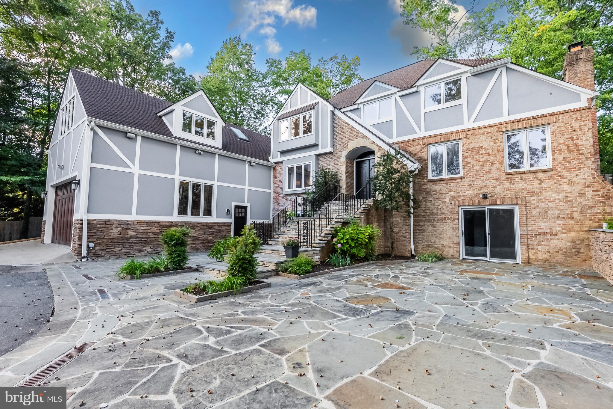 2352 Cedar Lane Vienna, VA 22182 - Photo 57 of 59 a view of a white house with plants and large tree