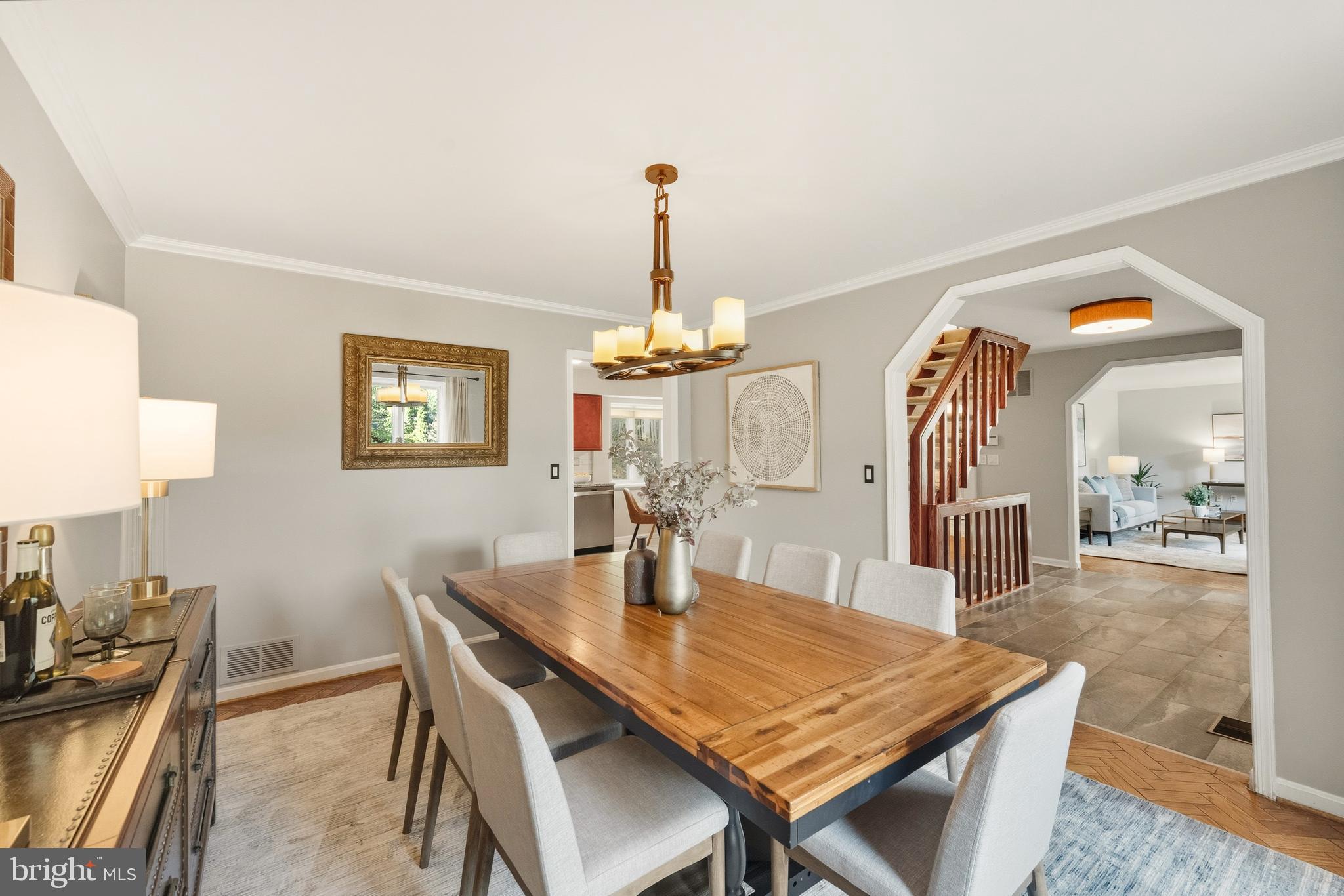 2352 Cedar Lane Vienna, VA 22182 - Photo 9 of 59 a dining room with furniture a chandelier and wooden floor