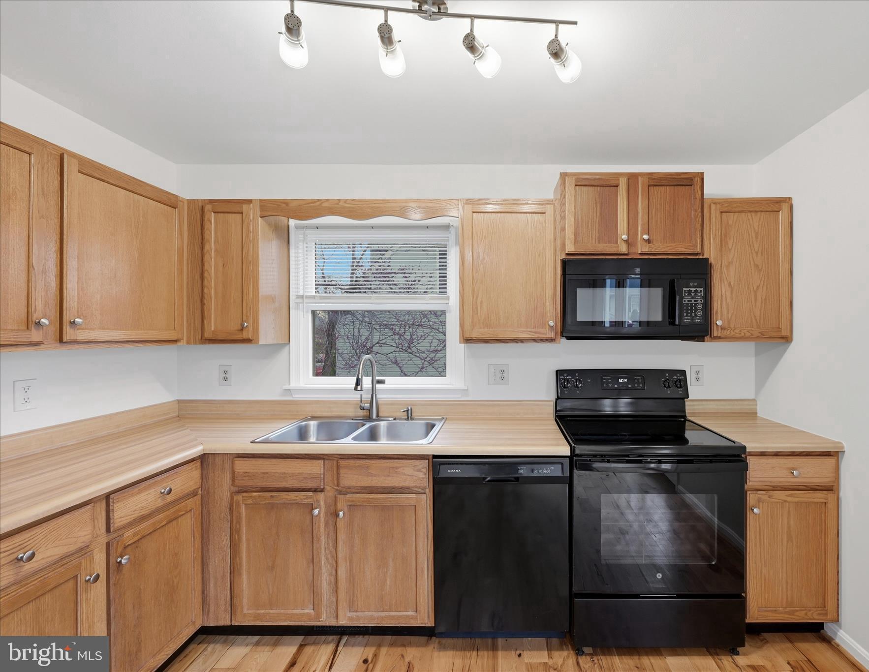 502 East 6th Avenue Ranson, WV 25438 - Photo 11 of 40 a kitchen with stainless steel appliances a sink stove and cabinets