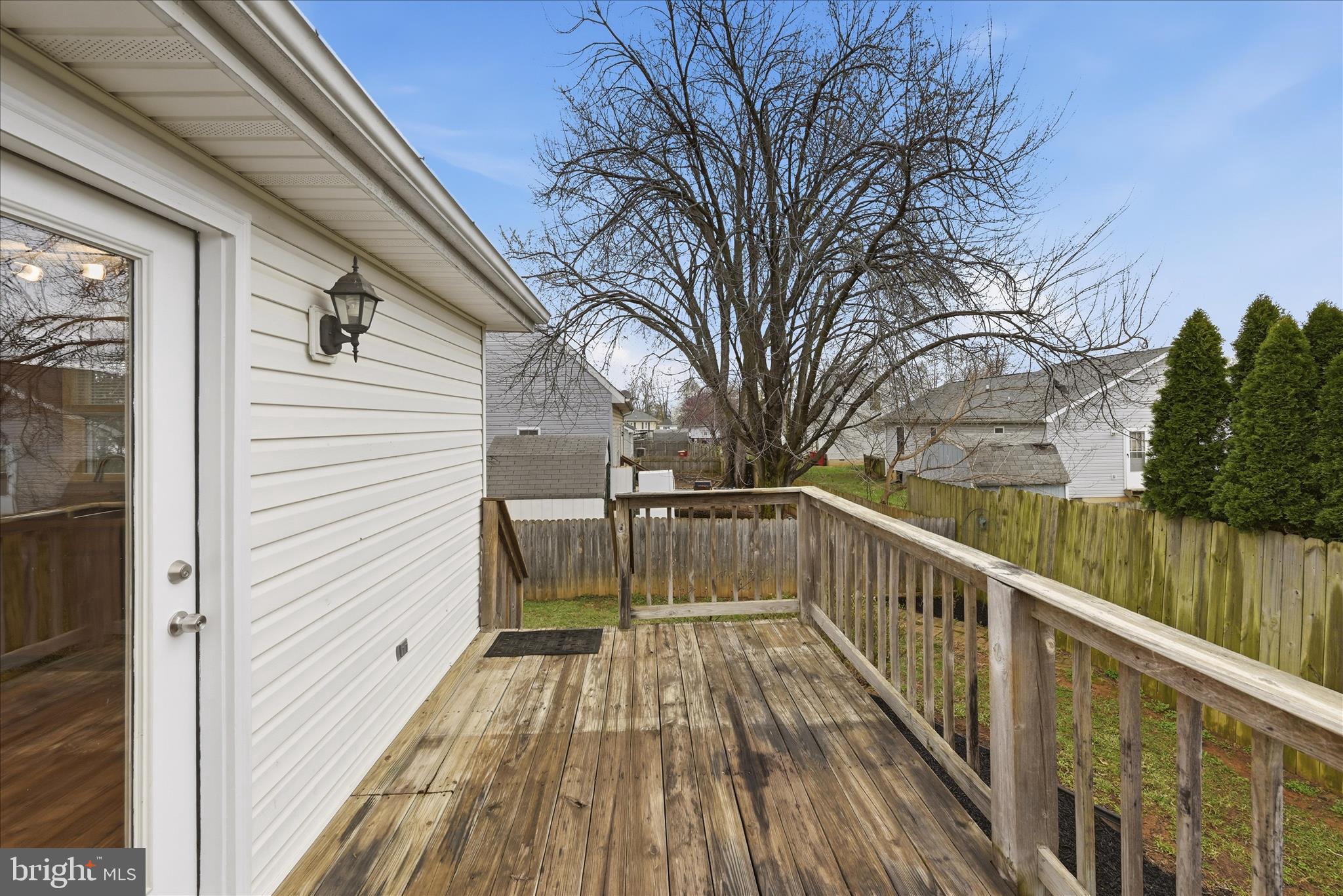502 East 6th Avenue Ranson, WV 25438 - Photo 16 of 40 a view of balcony with wooden floor and fence