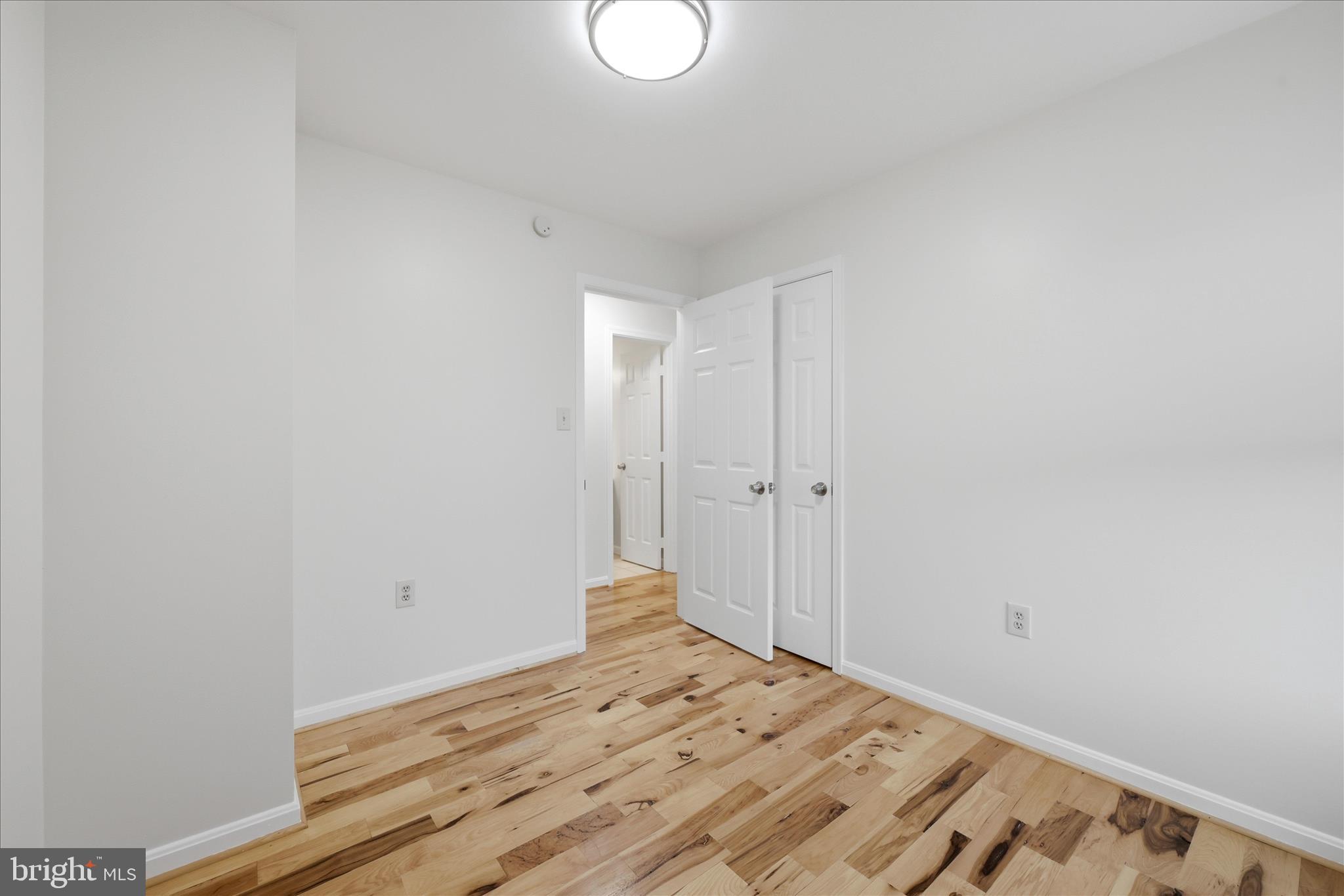 502 East 6th Avenue Ranson, WV 25438 - Photo 21 of 40 a view of a room with wooden floor and white walls