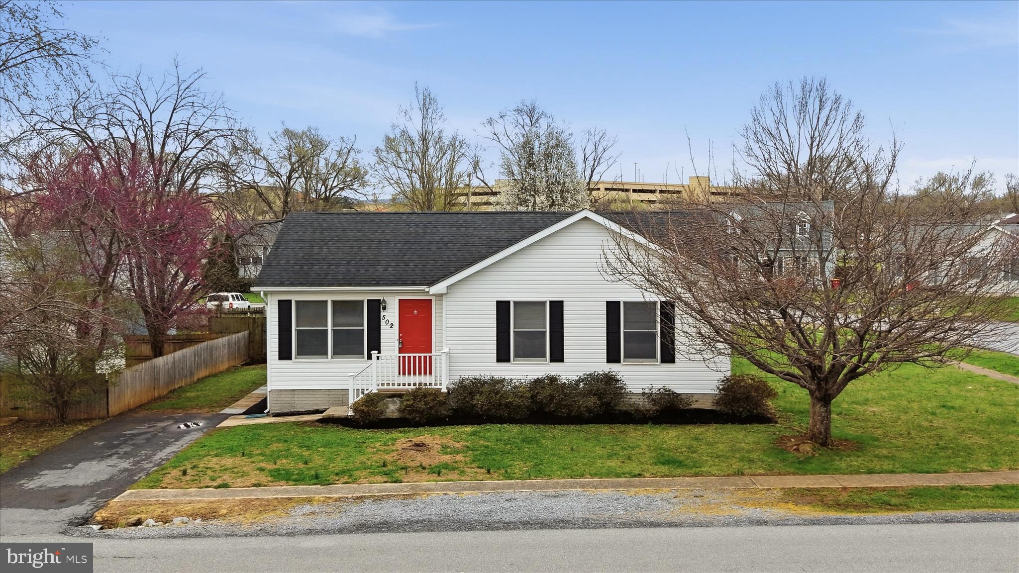 502 East 6th Avenue Ranson, WV 25438 - Photo 34 of 40 a front view of a house with a yard and trees