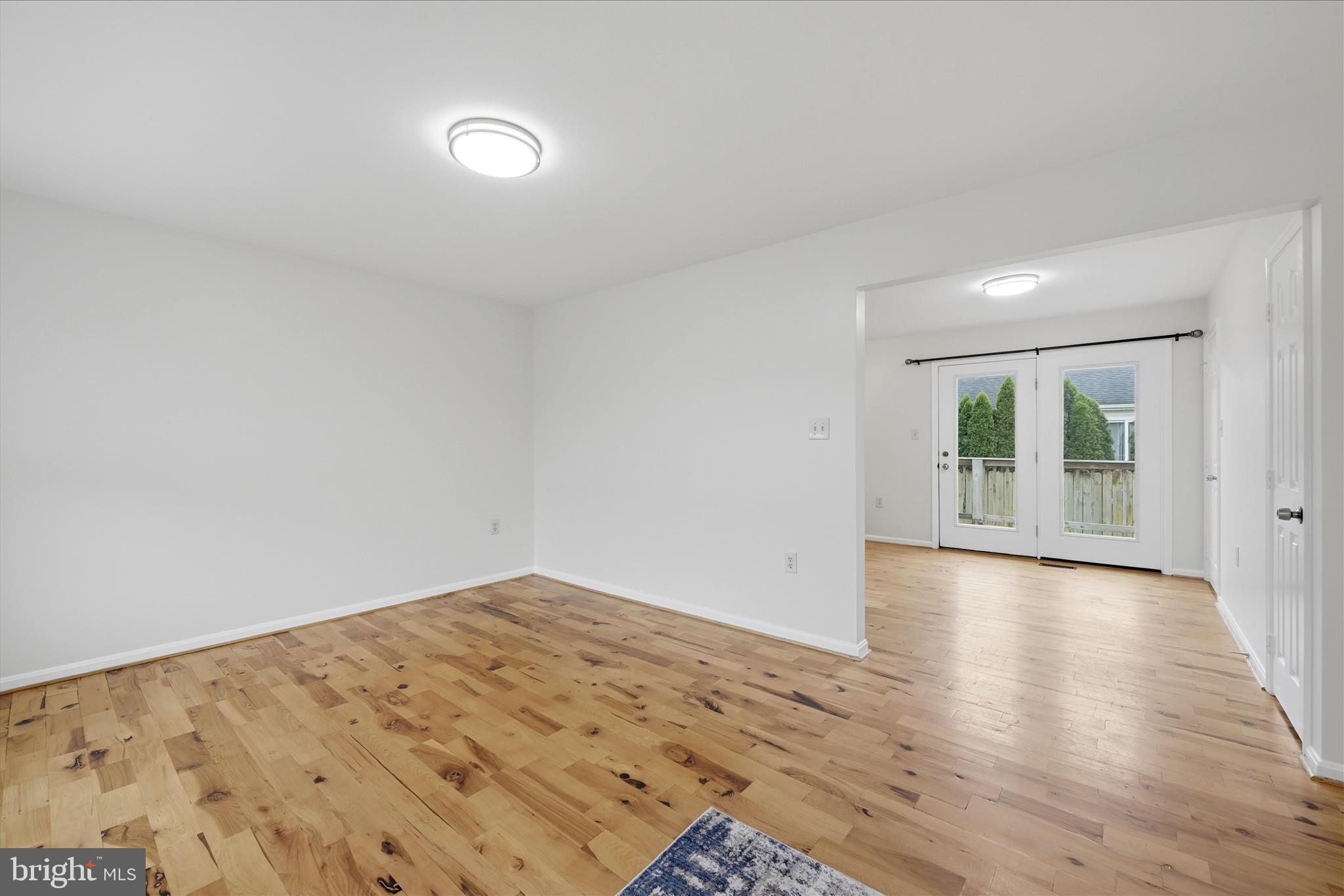 502 East 6th Avenue Ranson, WV 25438 - Photo 5 of 40 a view of an empty room with wooden floor and a window