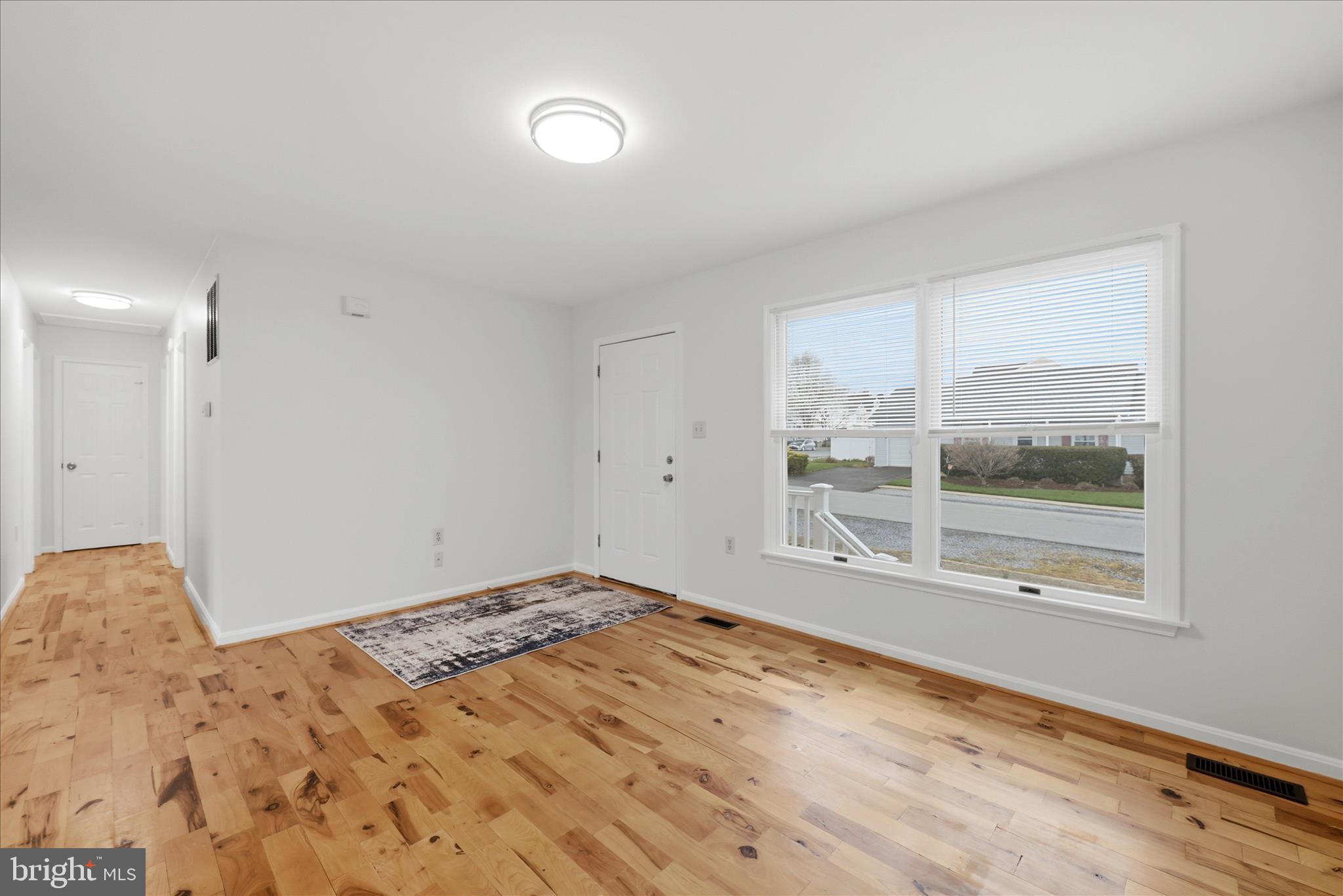 502 East 6th Avenue Ranson, WV 25438 - Photo 6 of 40 a view of a room with a bed and wooden floor