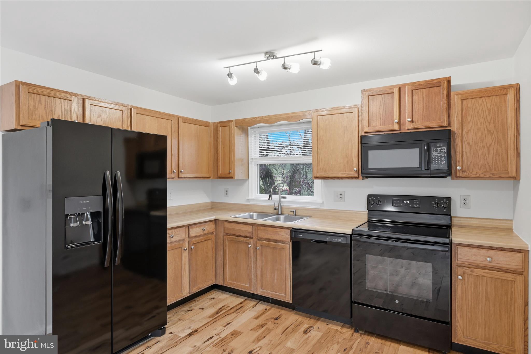 502 East 6th Avenue Ranson, WV 25438 - Photo 9 of 40 a kitchen with a sink stove and refrigerator