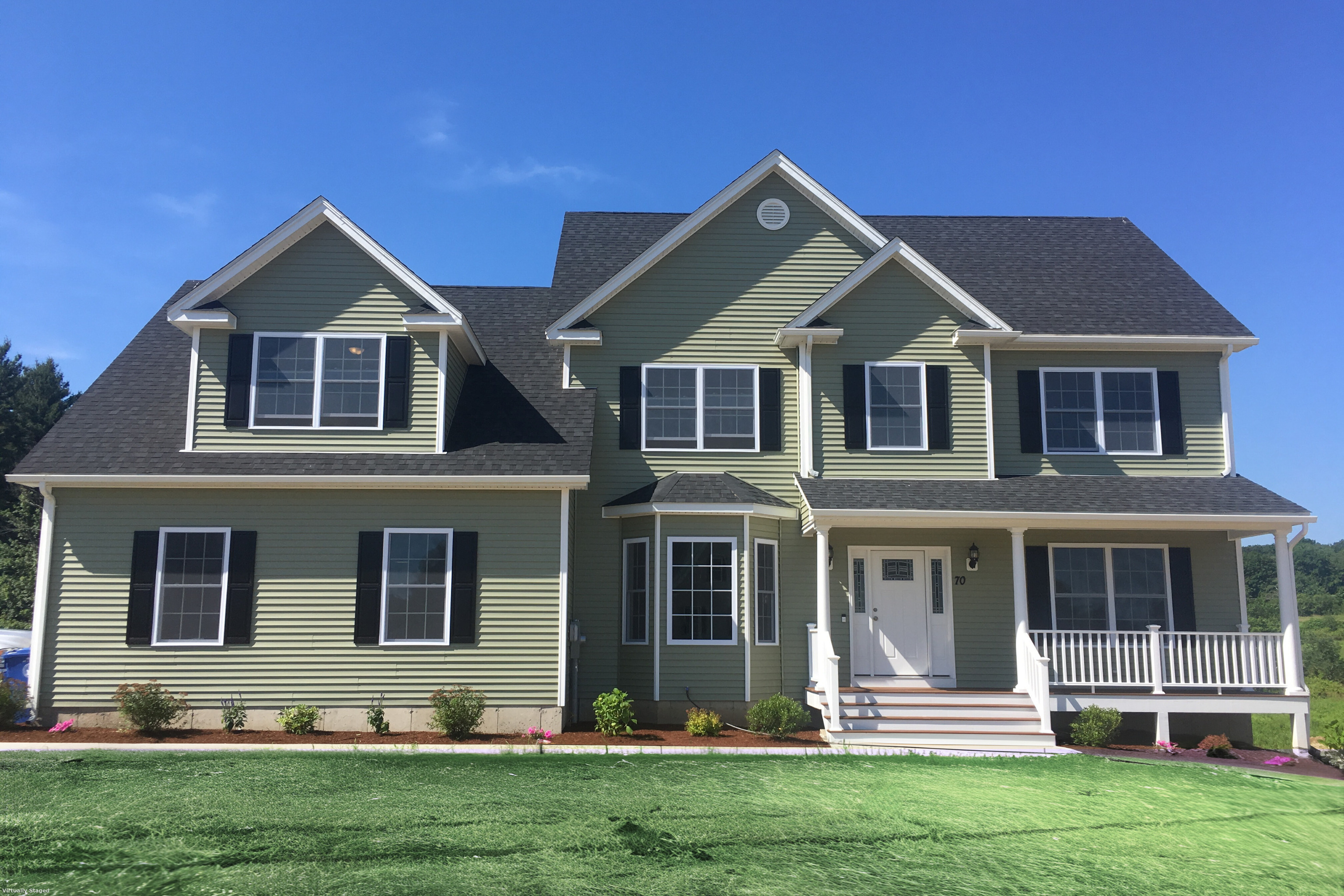 front view of a house with a yard