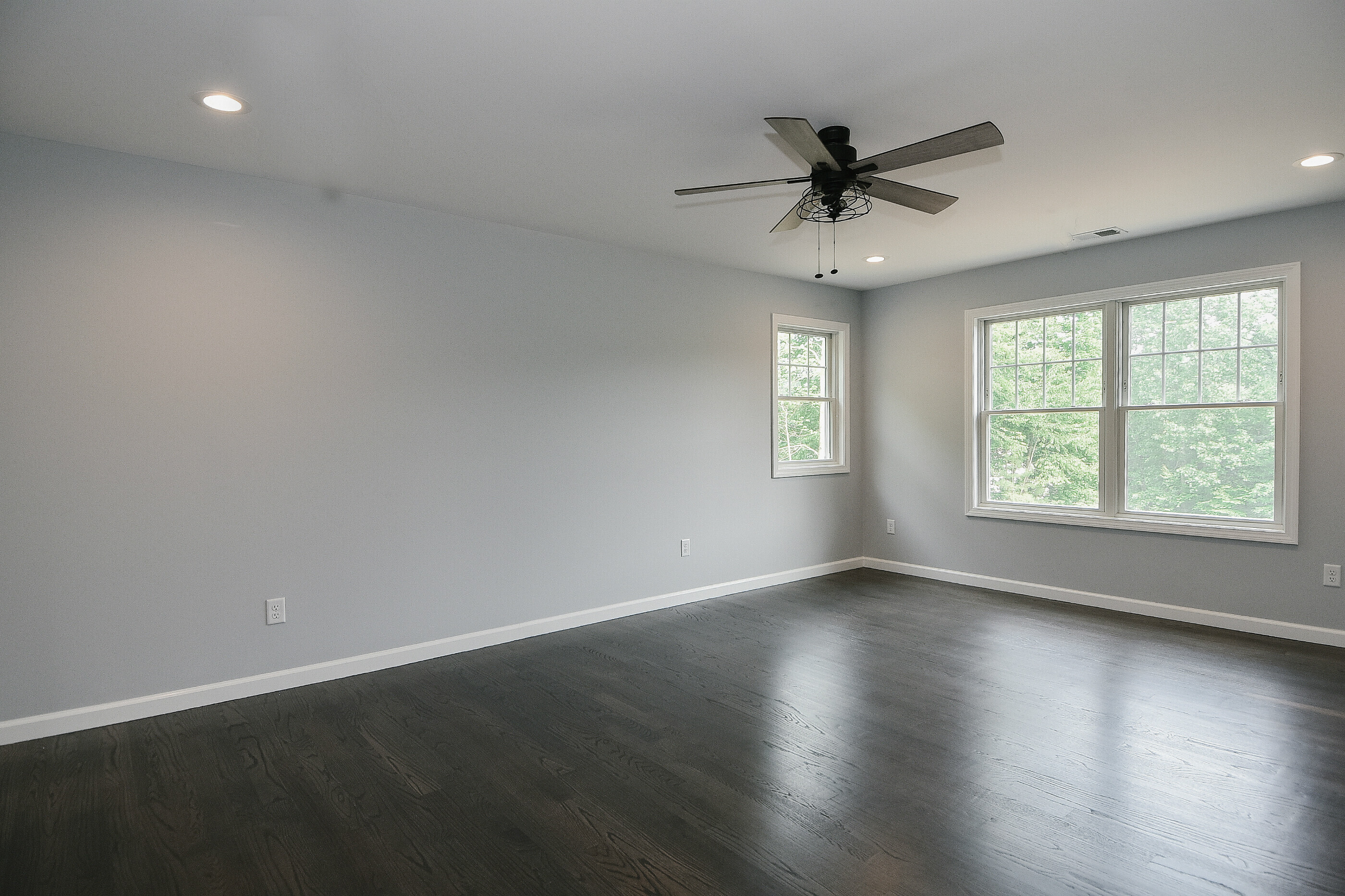 155 Old Common Road Wethersfield, CT 06109 - Photo 14 of 22 an empty room with wooden floor windows and fan