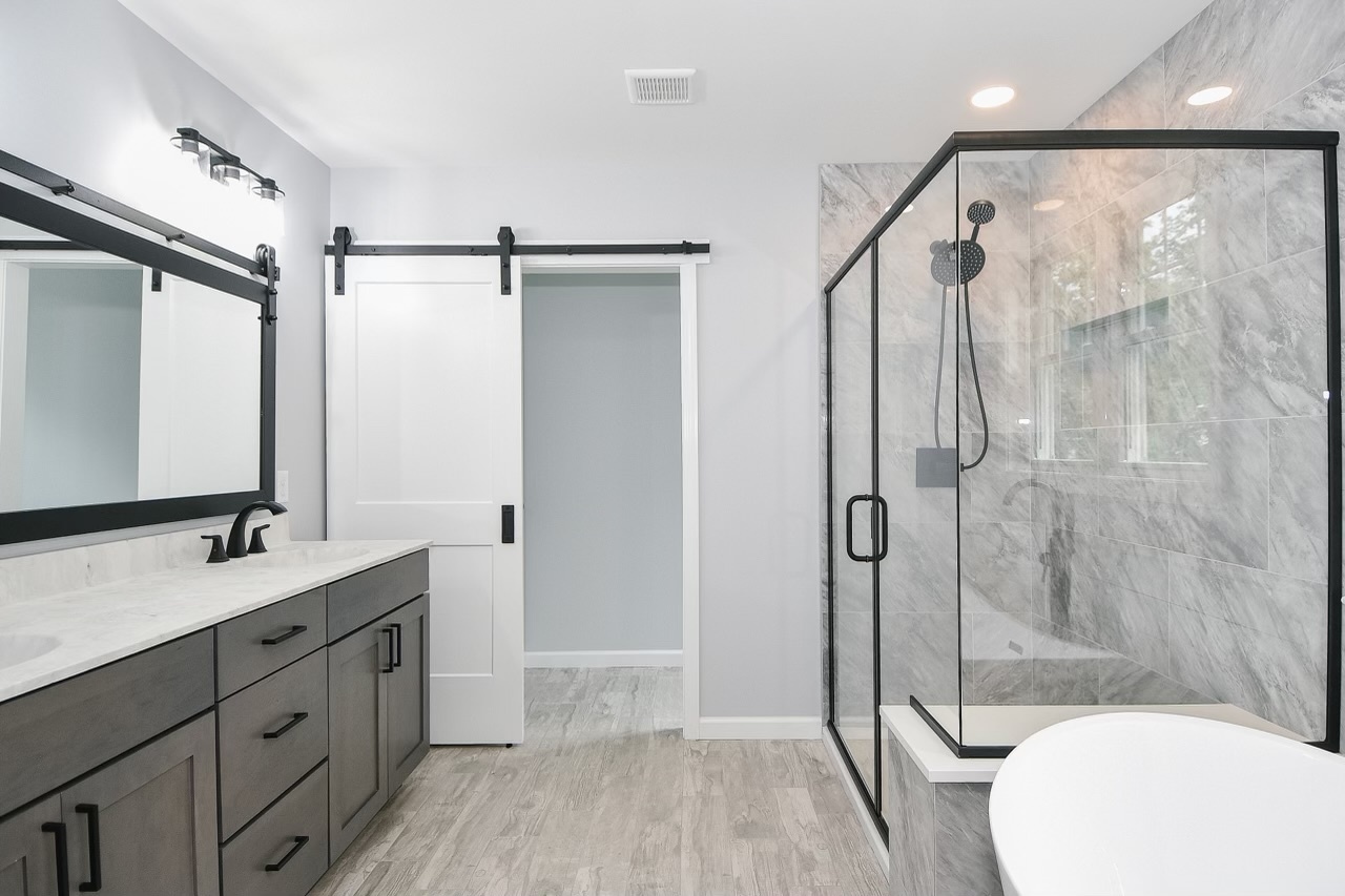 155 Old Common Road Wethersfield, CT 06109 - Photo 15 of 22 a bathroom with a double vanity sink toilet mirror and shower