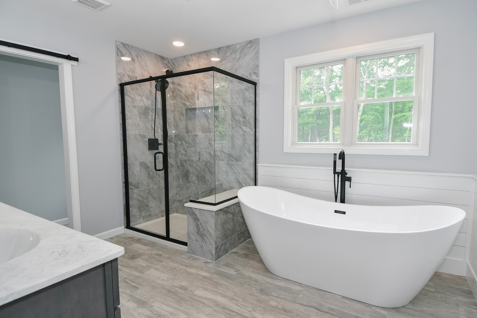 155 Old Common Road Wethersfield, CT 06109 - Photo 16 of 22 a white bath tub sitting next to a shower