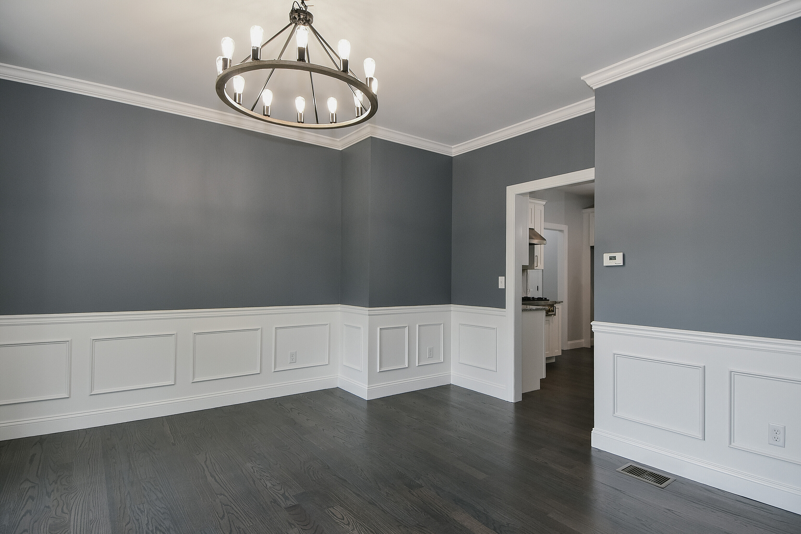 155 Old Common Road Wethersfield, CT 06109 - Photo 6 of 22 a kitchen with white cabinets and wooden floor