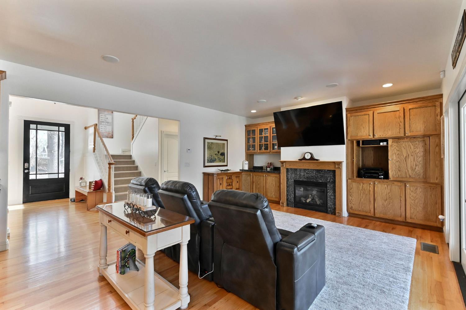 511 Surrey Lane Murphys, CA 95247 - Photo 11 of 97 a living room with furniture a flat screen tv and a fireplace