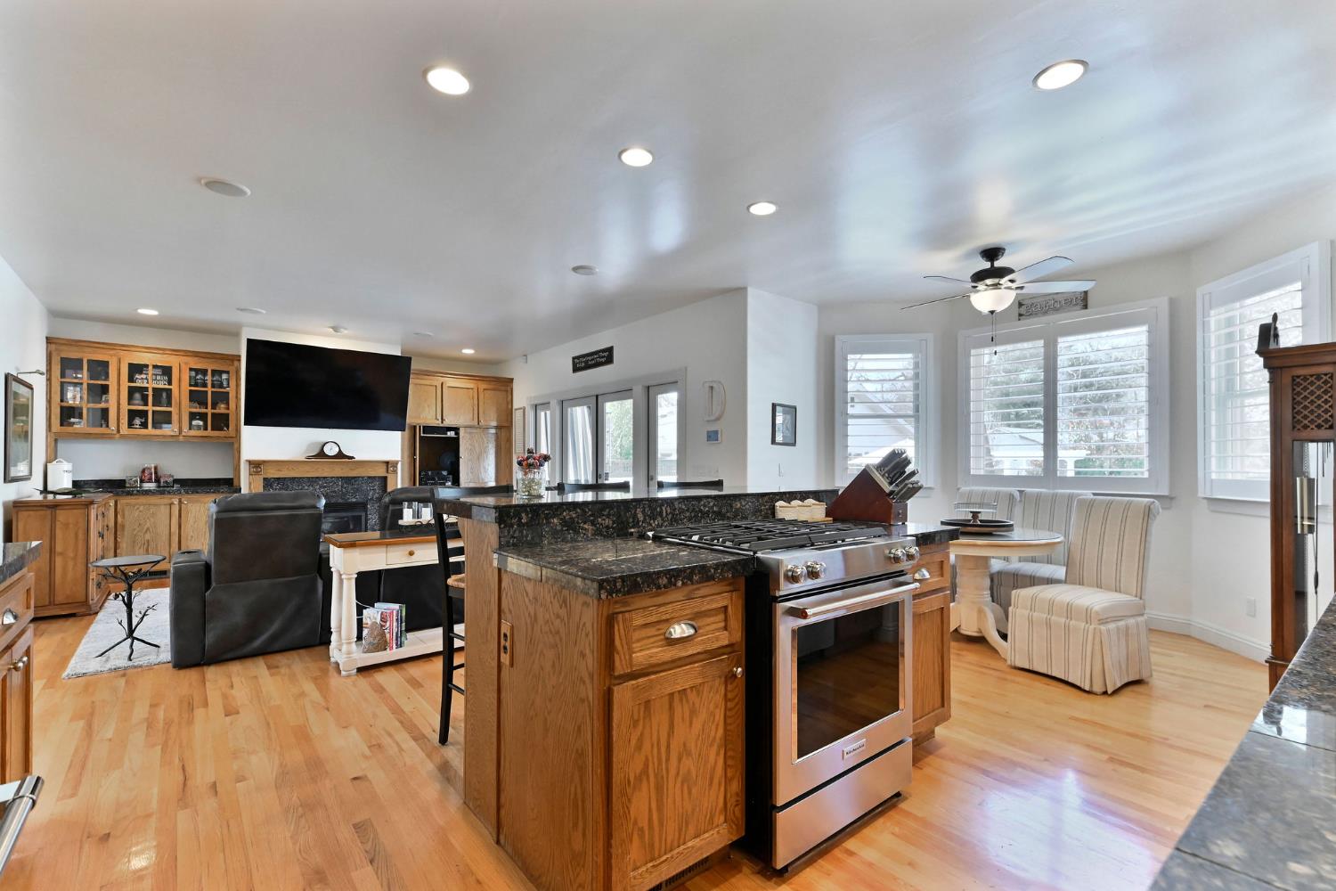 511 Surrey Lane Murphys, CA 95247 - Photo 16 of 97 a kitchen with stainless steel appliances granite countertop a stove and a wooden floors