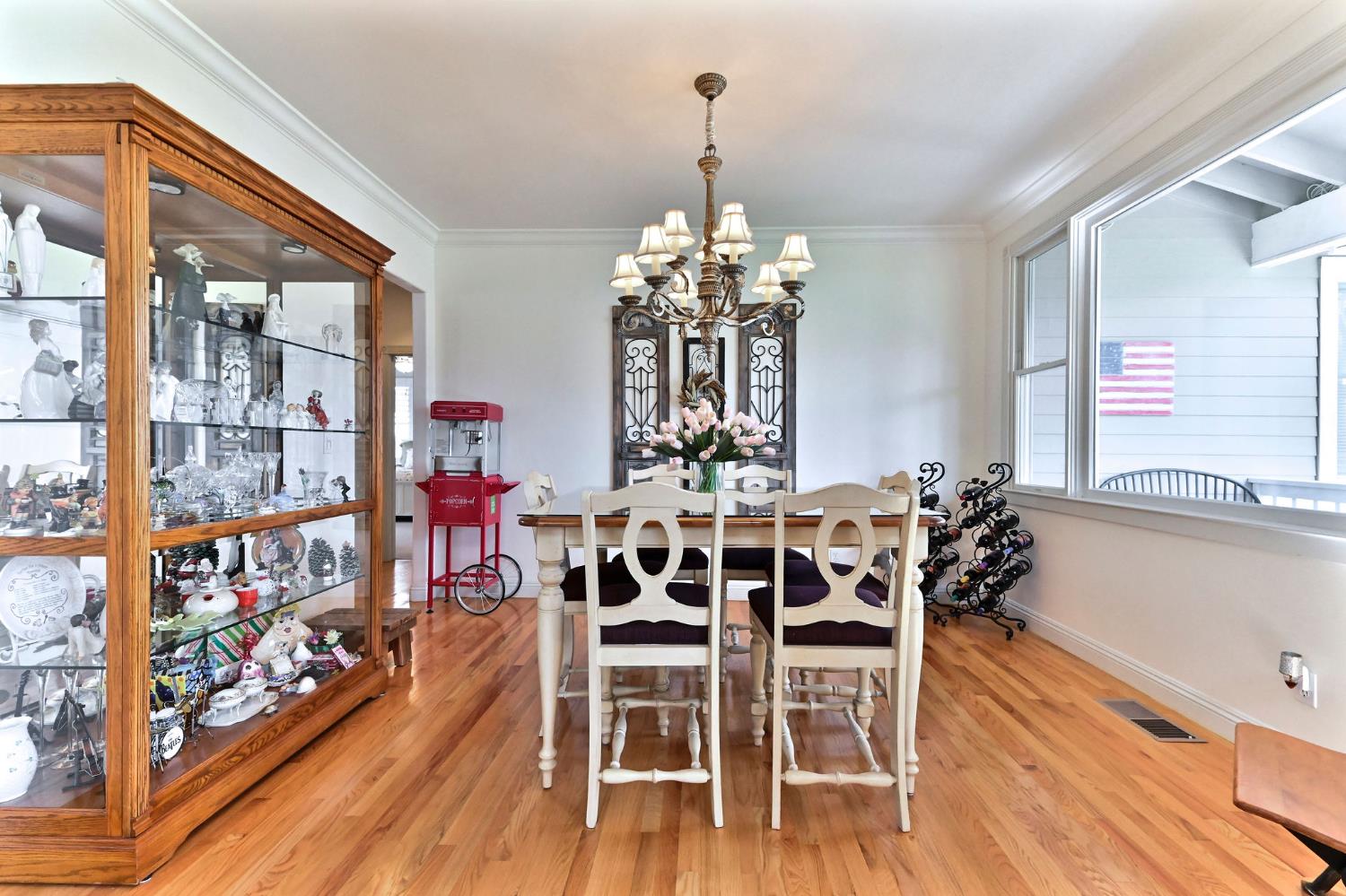 511 Surrey Lane Murphys, CA 95247 - Photo 24 of 97 a view of a dining room with furniture and wooden floor