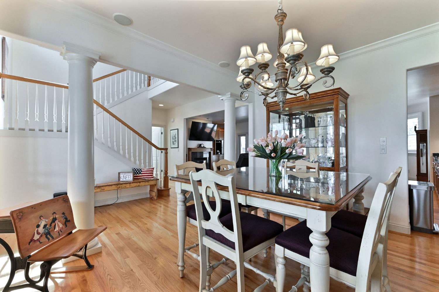 511 Surrey Lane Murphys, CA 95247 - Photo 25 of 97 a view of a dining room with furniture and wooden floor