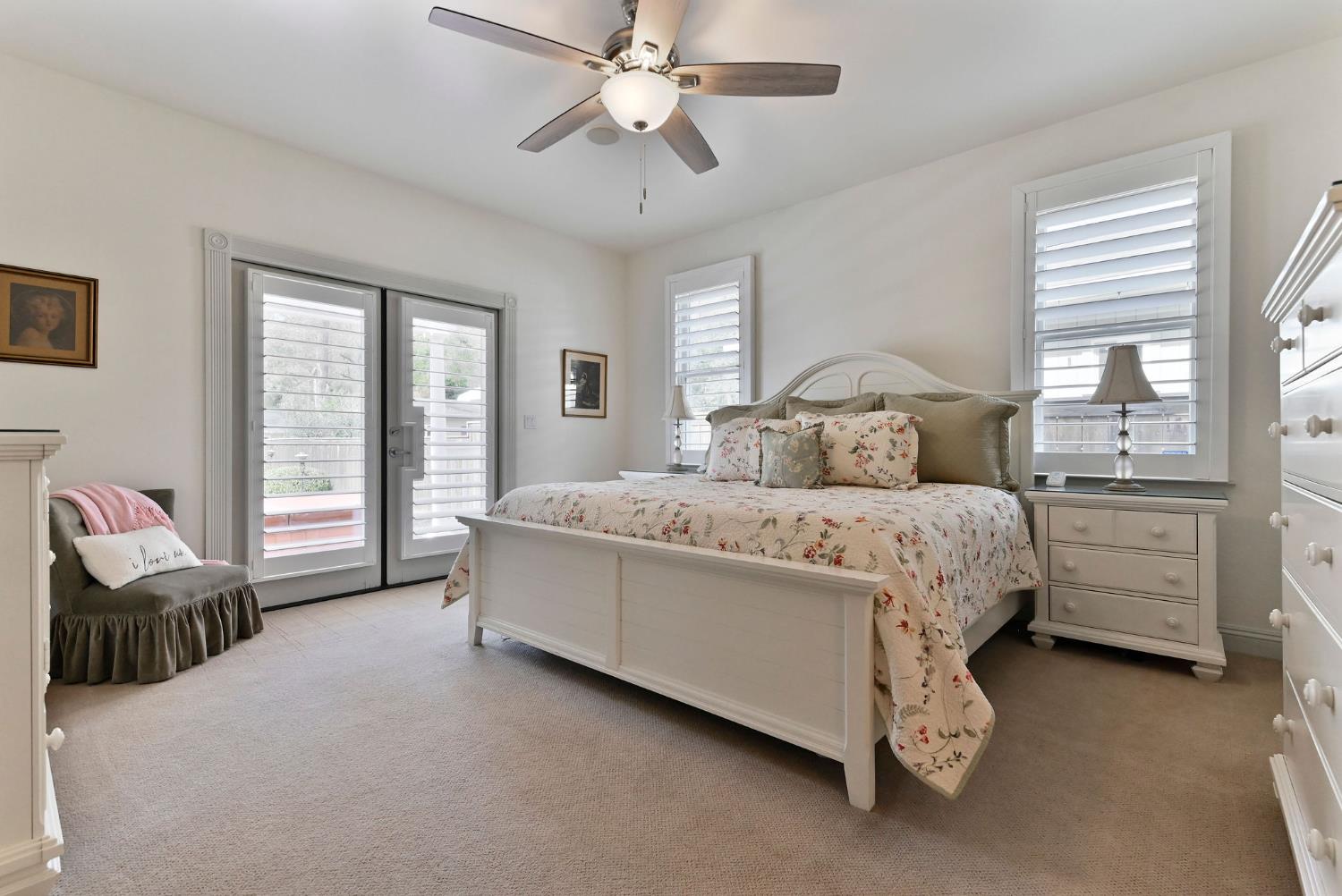 511 Surrey Lane Murphys, CA 95247 - Photo 28 of 97 a bed room with a bed and a chandelier