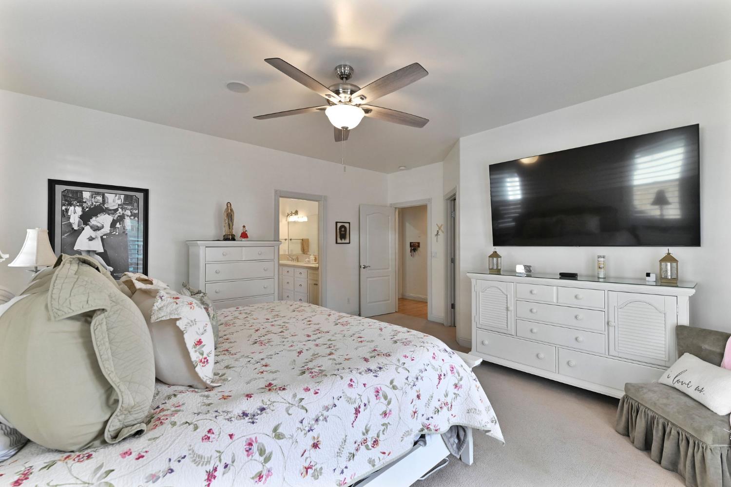 511 Surrey Lane Murphys, CA 95247 - Photo 32 of 97 a bedroom with a bed and a flat screen tv