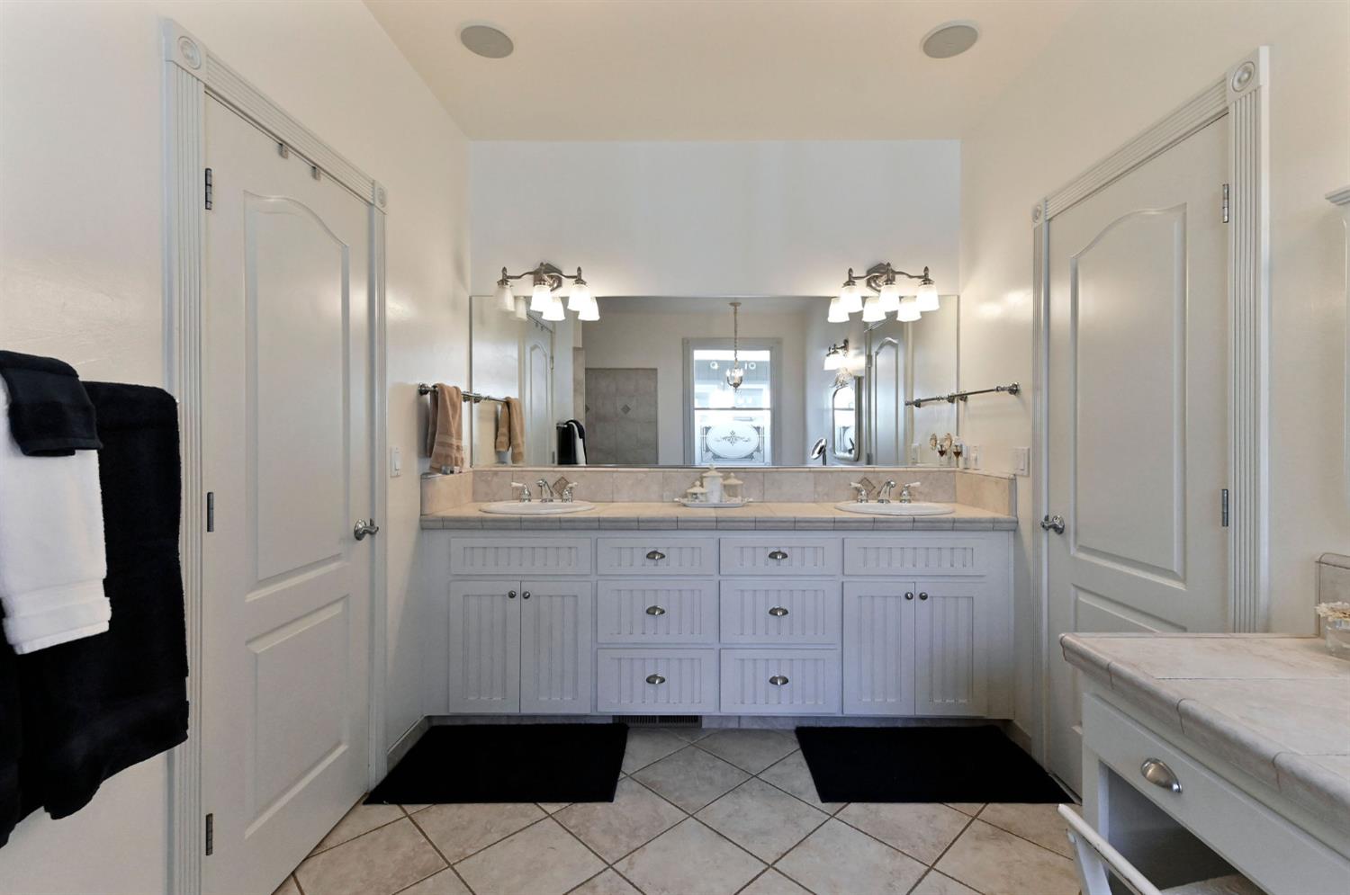 511 Surrey Lane Murphys, CA 95247 - Photo 35 of 97 a spacious bathroom with a mirror sink and toilet