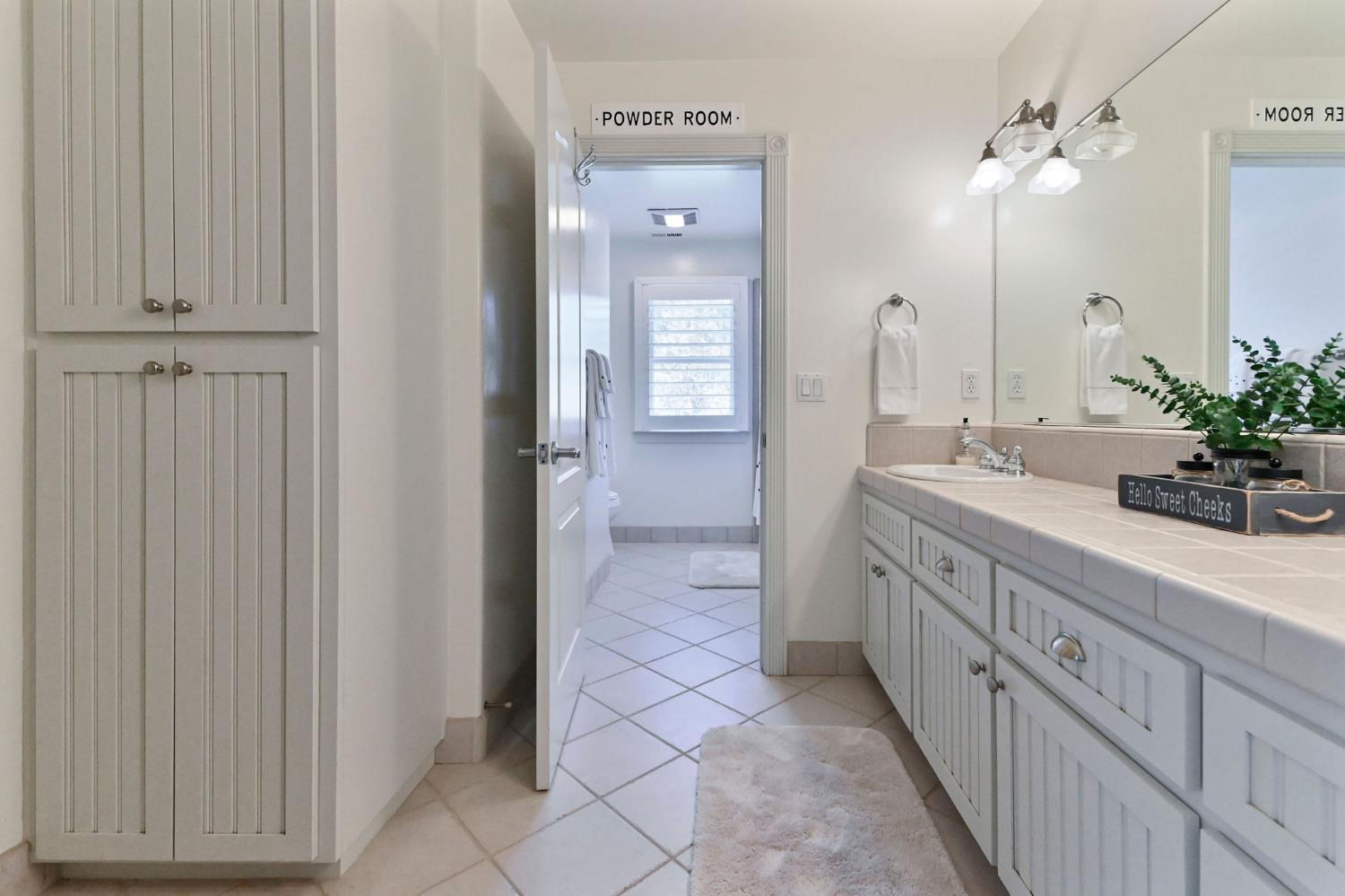 511 Surrey Lane Murphys, CA 95247 - Photo 44 of 97 a spacious bathroom with a double vanity sink a mirror and a shower