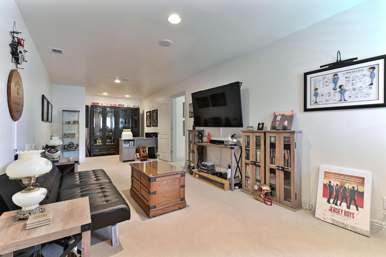 511 Surrey Lane Murphys, CA 95247 - Photo 49 of 97 a living room with furniture and a flat screen tv