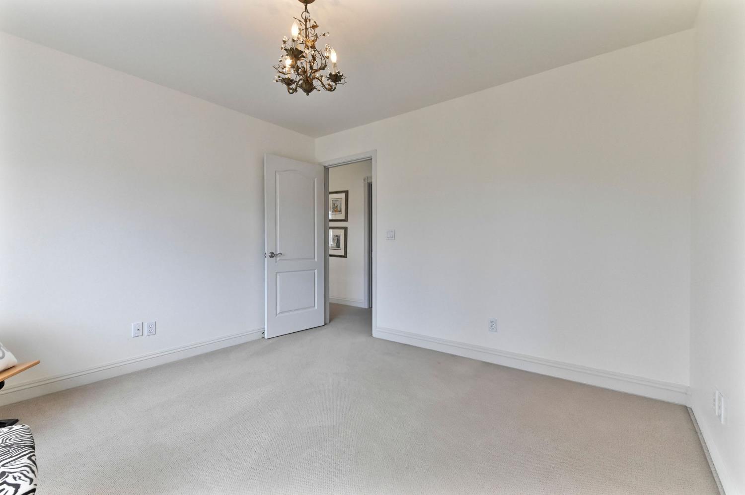 511 Surrey Lane Murphys, CA 95247 - Photo 51 of 97 an empty room with a chandelier fan