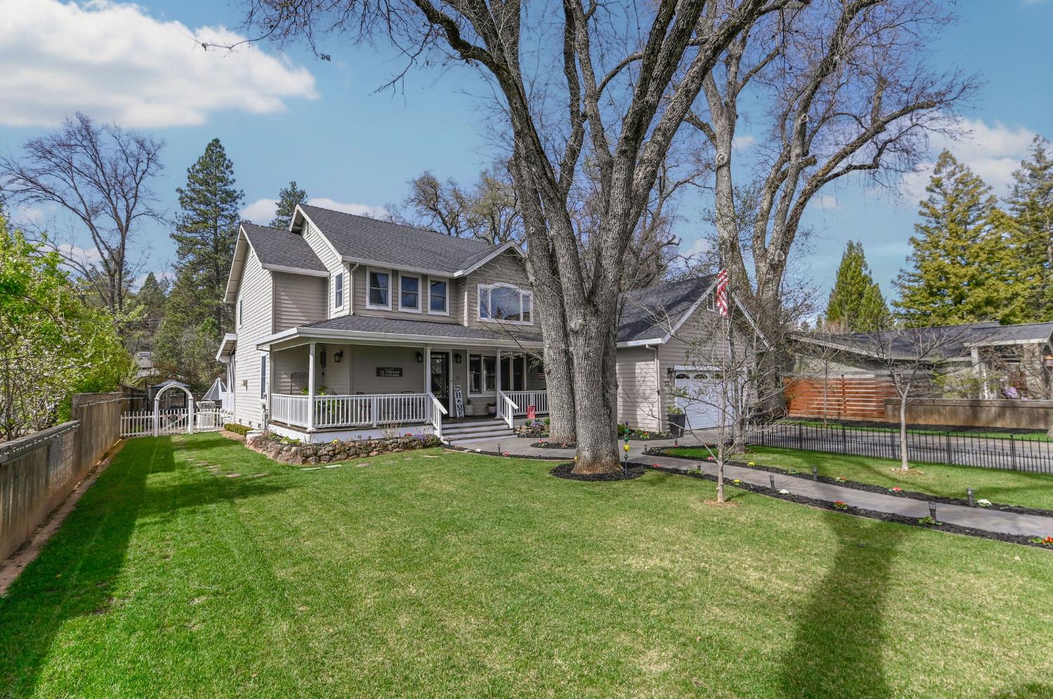 511 Surrey Lane Murphys, CA 95247 - Photo 53 of 97 a view of a house with a yard deck and a small cabin