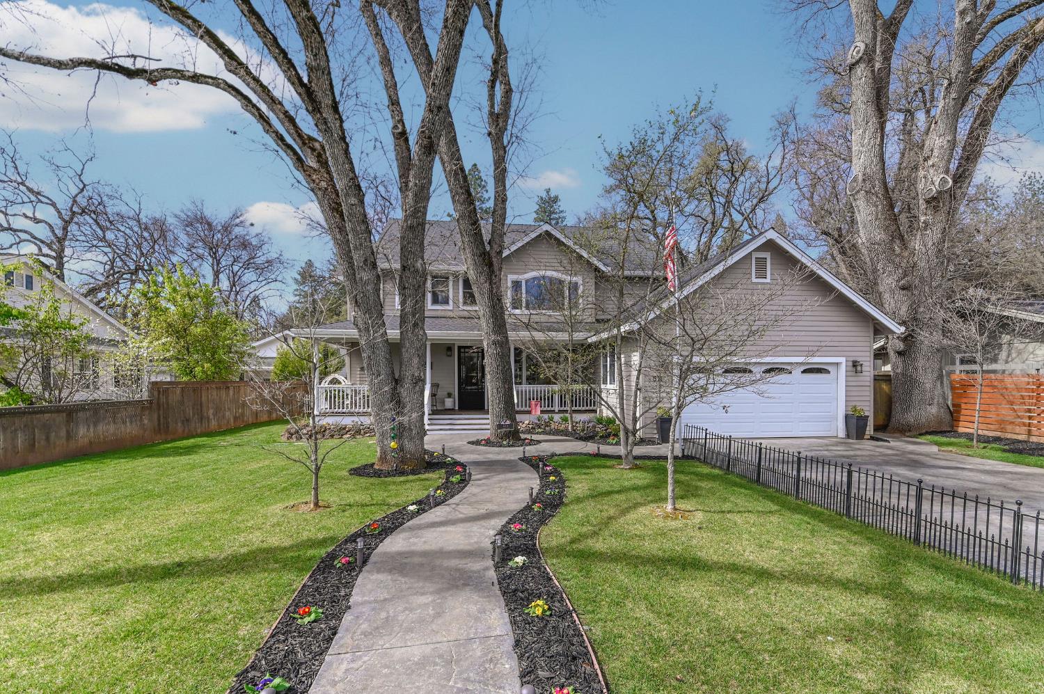 511 Surrey Lane Murphys, CA 95247 - Photo 55 of 97 a front view of a house with a yard table and chairs