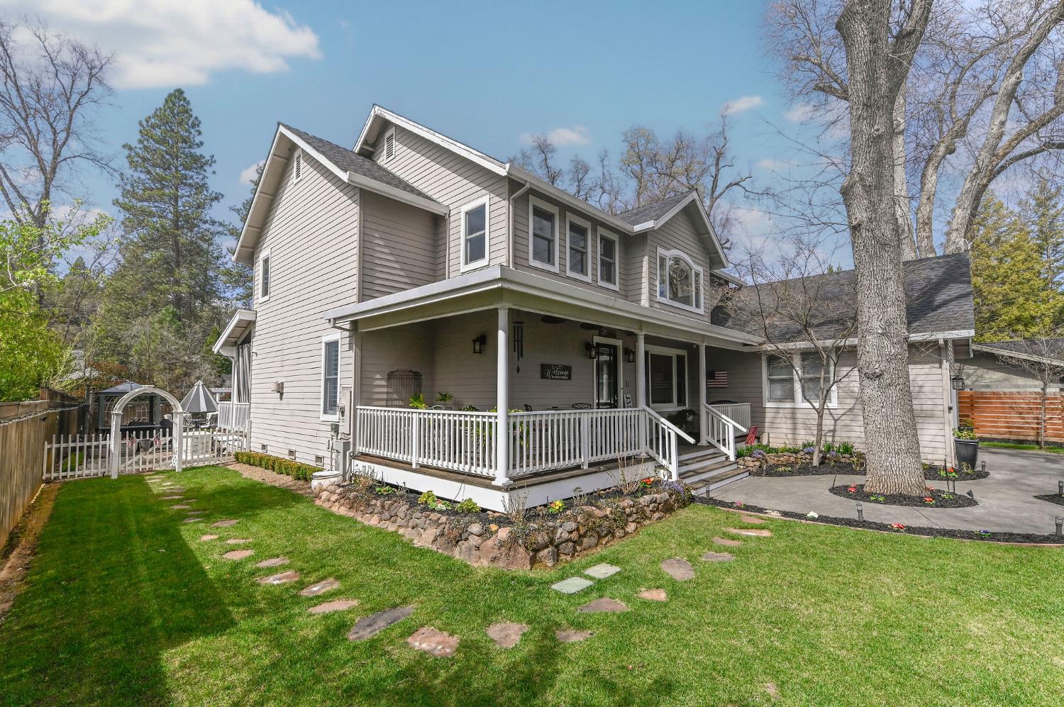 511 Surrey Lane Murphys, CA 95247 - Photo 60 of 97 a view of a house with backyard porch and a garden