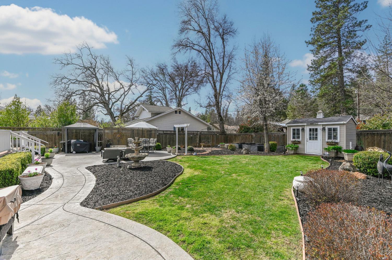 511 Surrey Lane Murphys, CA 95247 - Photo 72 of 97 a view of a house with backyard sitting area and garden