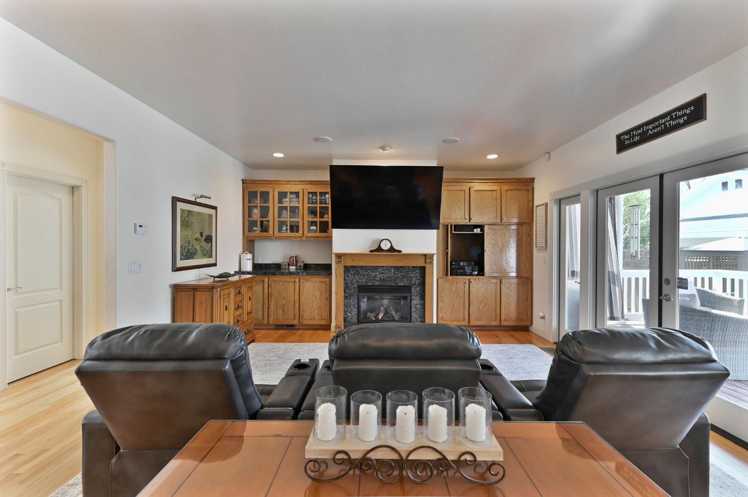 511 Surrey Lane Murphys, CA 95247 - Photo 10 of 97 a living room with furniture a flat screen tv and a fireplace